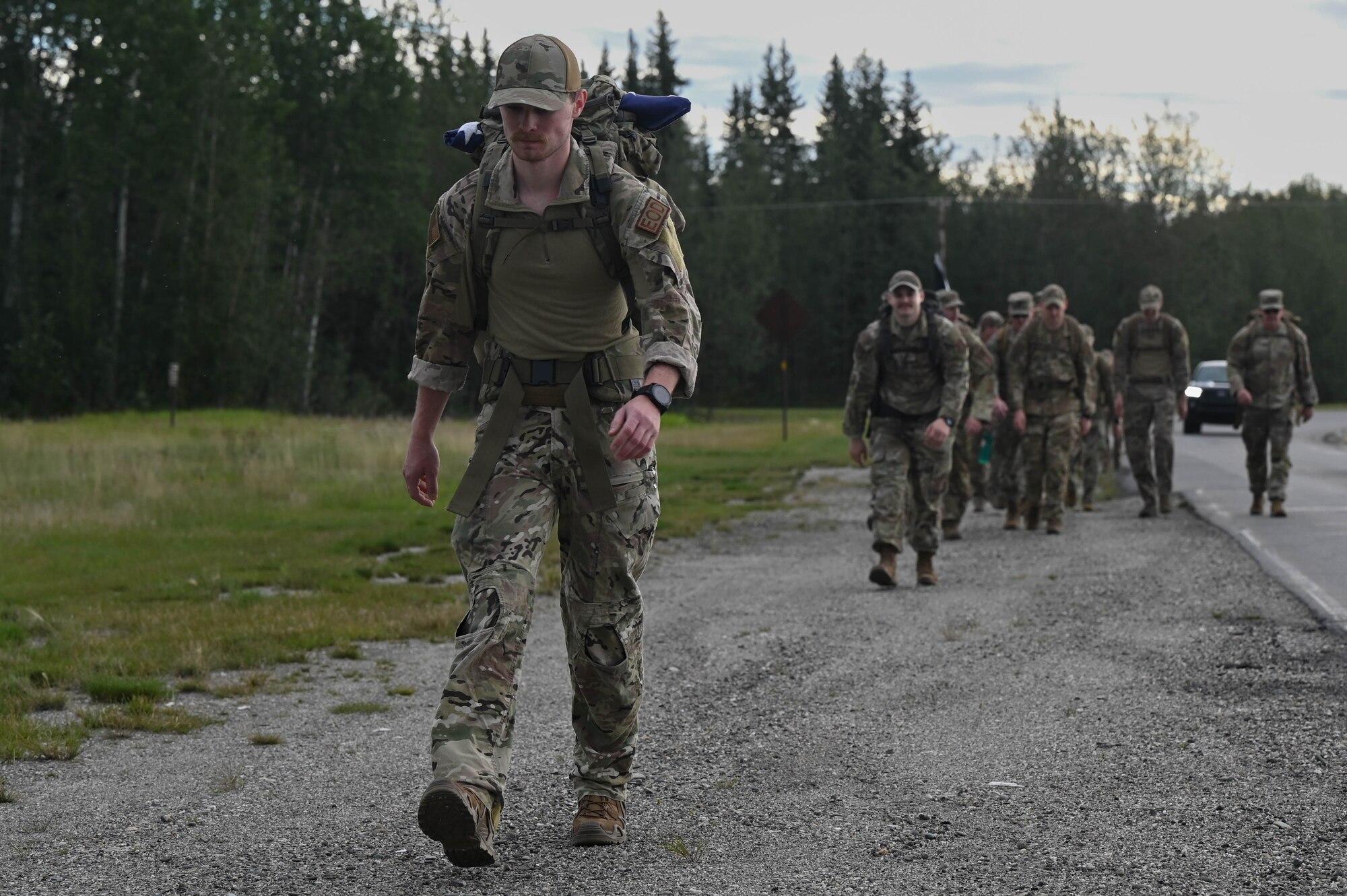 U.S. Air Force Senior Airman Camden Mueth, 354th Civil Engineer Squadron explosive ordnance disposal journeymen, marches in the arctic memorial ruck at Eielson Air Force Base, Alaska, Aug. 16, 2024.