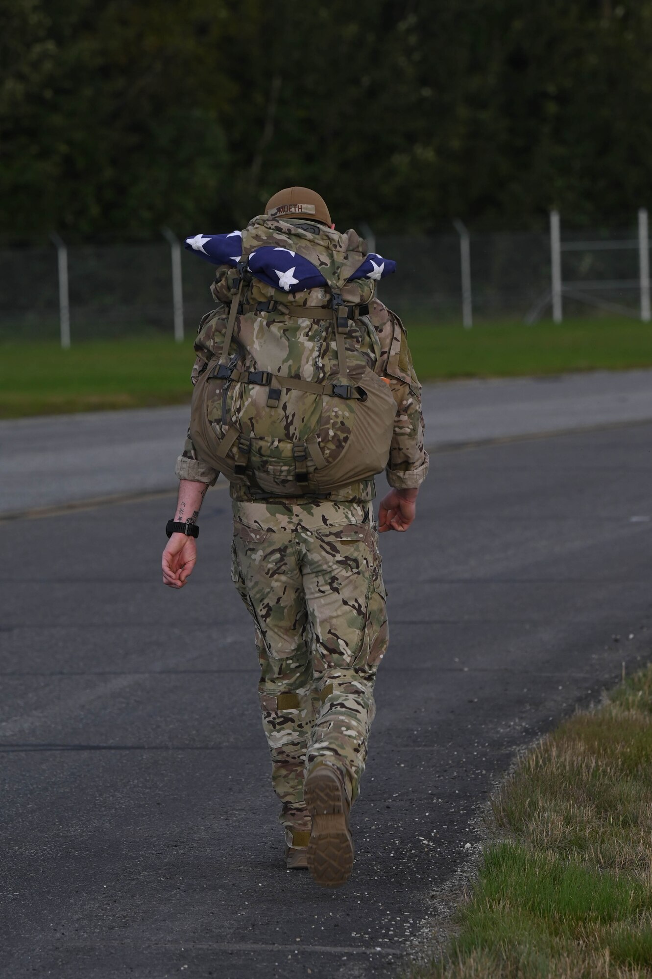 U.S. Air Force Senior Airman Camden Mueth, 354th Civil Engineer Squadron explosive ordnance disposal journeymen, marches in the arctic memorial ruck at Eielson Air Force Base, Alaska, Aug. 16, 2024.