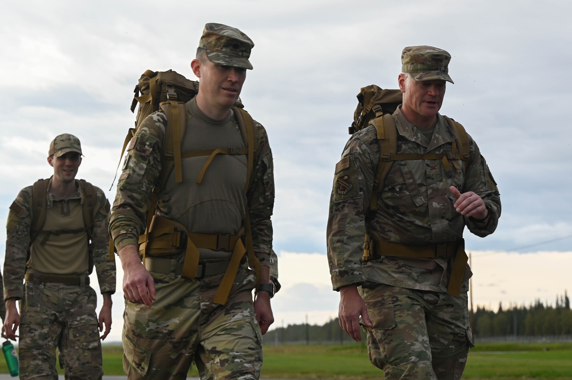 U.S. Air Force Lt. Col. Brendan Dorsey-Spitz, front left, 354th Civil Engineer Squadron commander, and Col. Paul Townsend, right, 354th Fighter Wing commander, march in the arctic memorial ruck at Eielson Air Force Base, Alaska, Aug. 16, 2024.