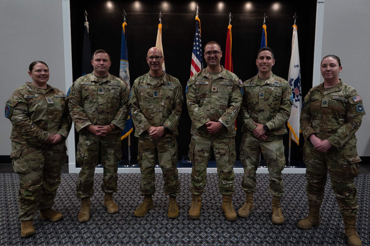 Chief Master Sergeant of the Space Force John Bentivegna poses with Space Force Detachment 1 staff at the Powell Event Center, Goodfellow Air Force Base, Texas, Aug. 16, 2024. Bentivegna spoke on the role of the Space Force in the Department of Defense and how the current Guardians are shaping the identity and culture of the service. (U.S. Air Force photo by Airman 1st Class Brian Lummus)