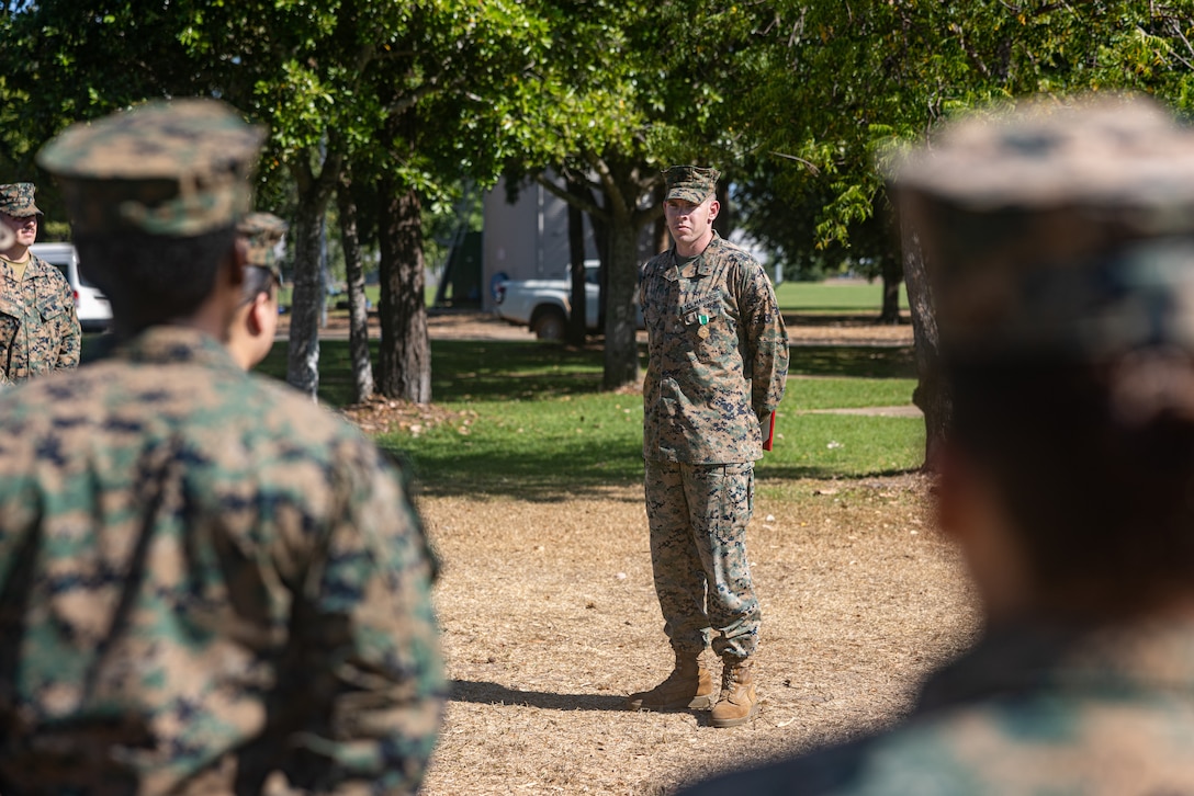 U.S. Marine Corps 1st Lt. Erik LeMoine, center, a supply officer with Combat Logistics Battalion 5 (Reinforced), Marine Rotational Force – Darwin 24.3, gives a speech after an award ceremony at Robertson Barracks, NT, Australia, Aug. 21, 2024. On May 17, 2024, LeMoine was swimming at Robertson Barracks when he noticed a Marine was motionless at the bottom of the pool. Without hesitation, Lemoine pulled him out of the water and performed five minutes of cardiopulmonary resuscitation before paramedics took over care. LeMoine is a native of Nebraska. (U.S. Marine Corps photo by Cpl. Juan Torres)