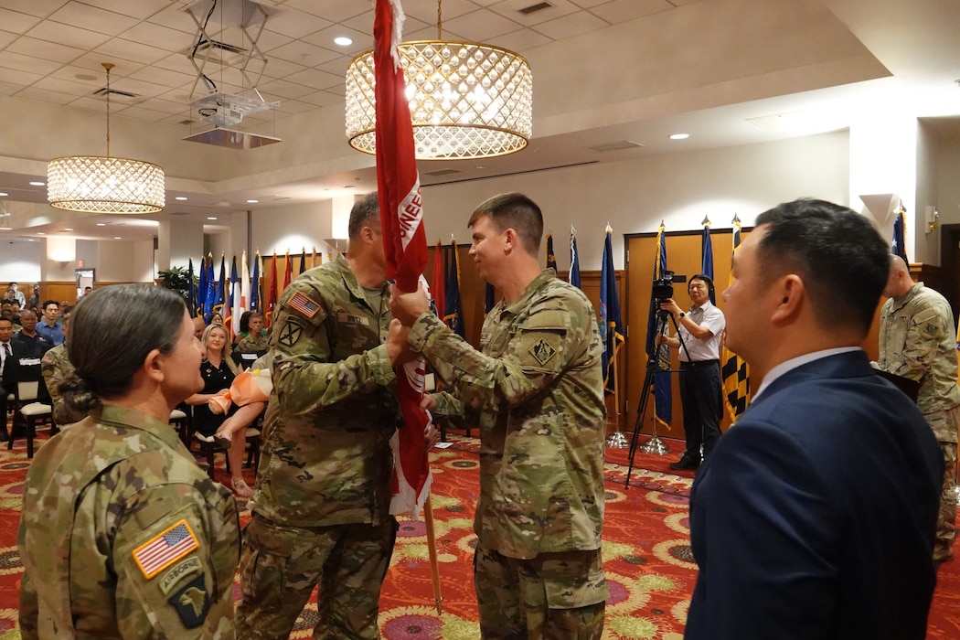 Brig. Gen. Joseph C. “Clete” Goetz II, U.S. Army Corps of Engineers (USACE) – Pacific Ocean Division (POD) commanding general, passes the district colors to Col. Jeremiah J. Willis, the incoming commander of the USACE Far East District (FED), during a change of command ceremony held at River Bend Golf Course, USAG Humphreys, Republic of Korea, August 21, 2024. Willis, who most recently served as the Command Engineer for the Joint Special Operations Command, brings extensive leadership experience and expertise to his new role as the 39th Commander of FED. (U.S. Army Photo by Mr. O, Sang Song)