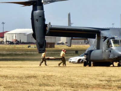 Members carry a stretcher.