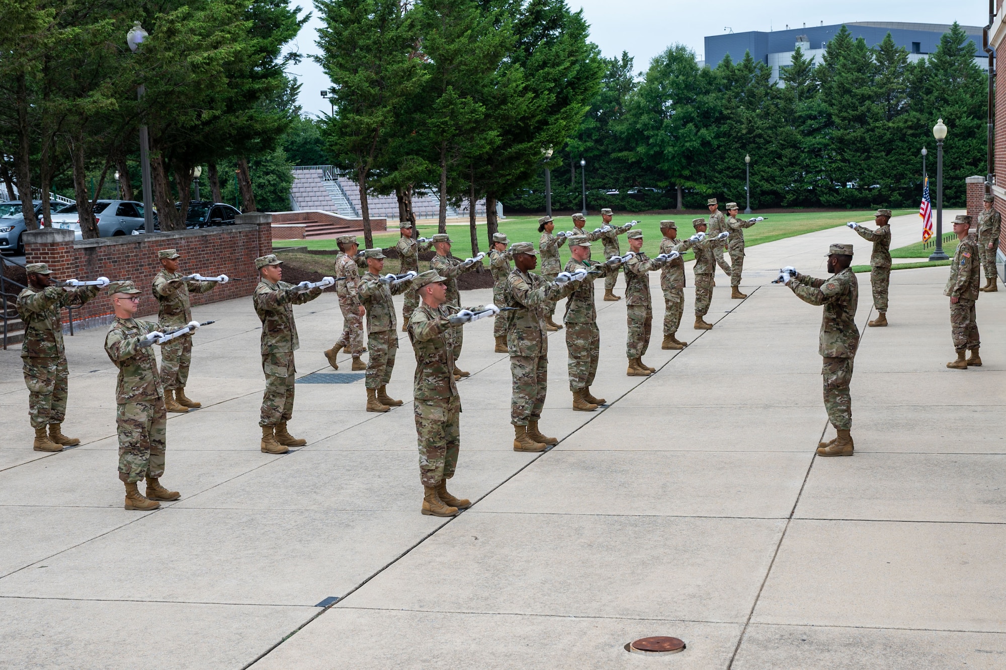 U.S. Air Force Airmen and U.S. Space Force Guardians perform physical training with rifles