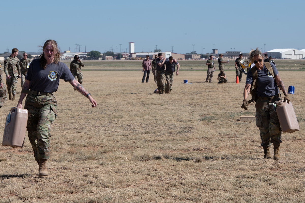 U.S. Airmen assigned to the 27th Special Operations Medical Readiness Squadron participate in the Air Commando Challenge during exercise Medic Rodeo at Cannon Air Force Base, New Mexico, Aug. 15, 2024. In addition to practical scenarios, the 18 competing teams also participated in the Air Commando Challenge, a physically demanding relay which included dragging a simulated patient in a litter over 200 meters. (U.S. Air Force photo by Senior Airman Drew Cyburt)