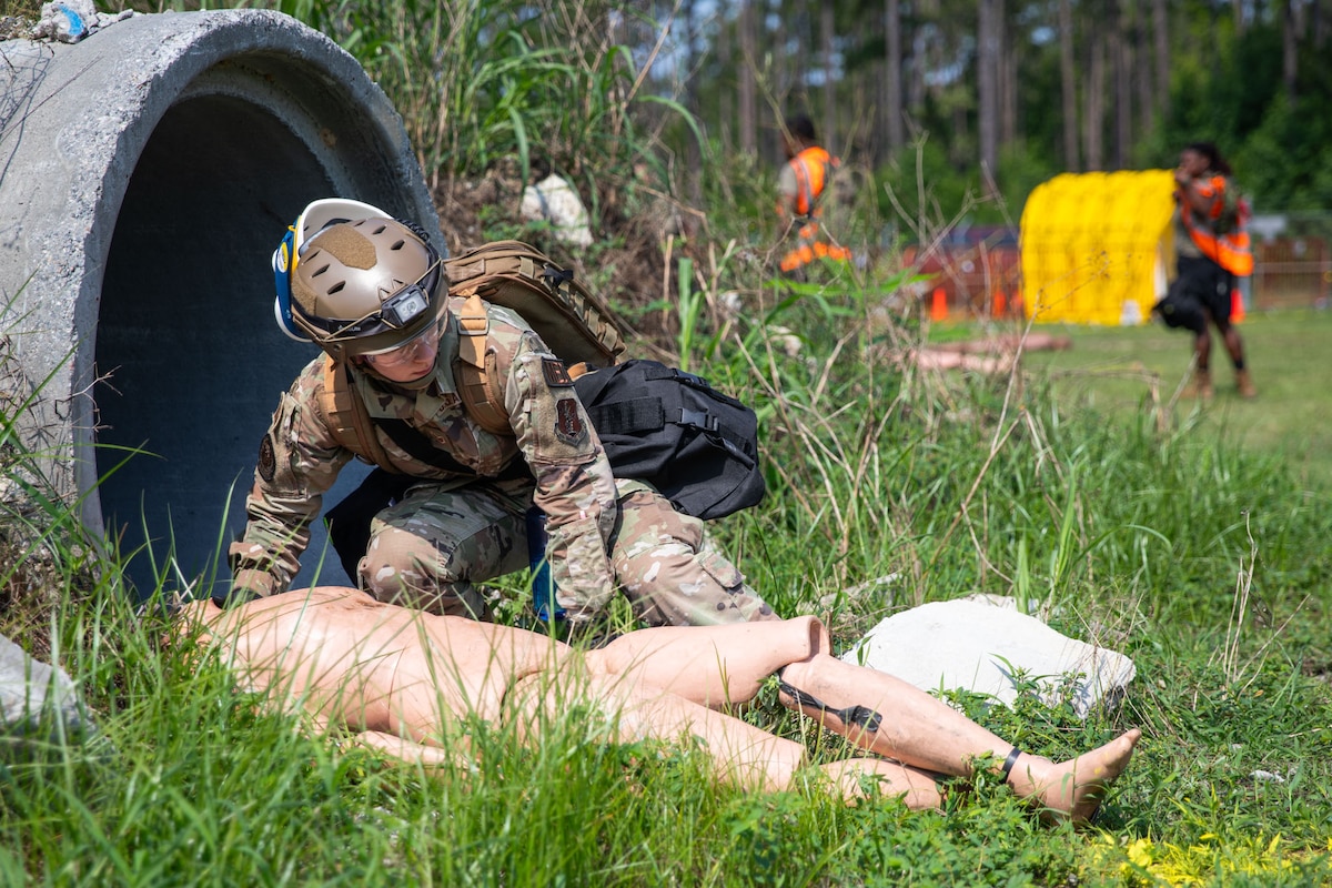 Airmen of the KYNG CERF-P search for simulated casualties during a Joint Training Exercise with the GANG