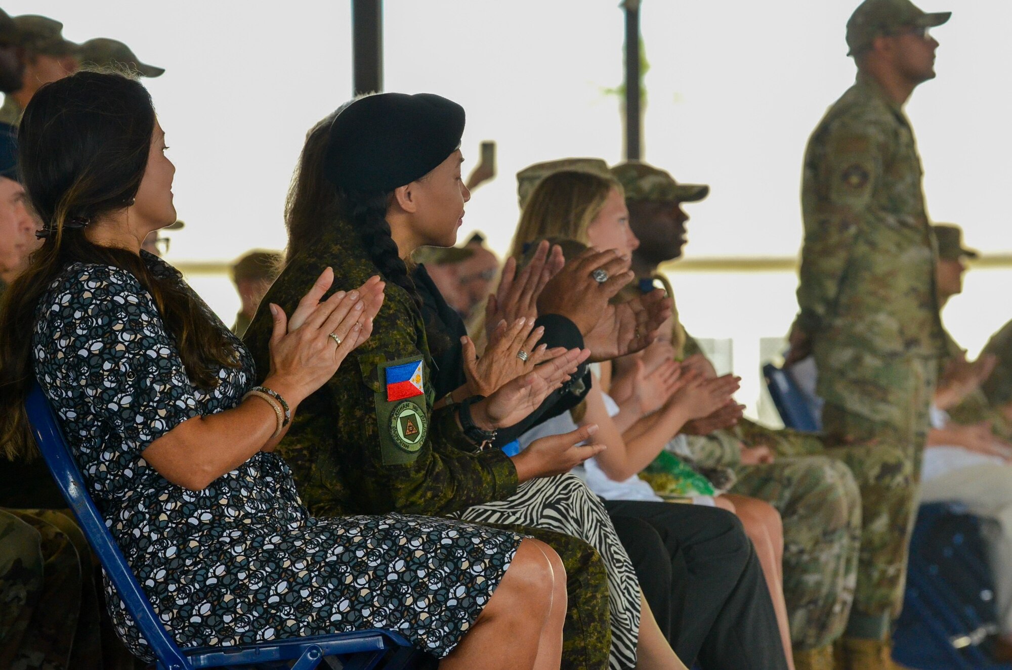 Filipino Army Air Traffic Controller and recently graduated Defense Language Institute English Language Center student, First Lieutenant Febe Salina Acenas, attends her cousin, Lt. Col. Matthew Redaja’s, change of command ceremony at Joint Base San Antonio-Lackland, Texas, June 10, 2024.