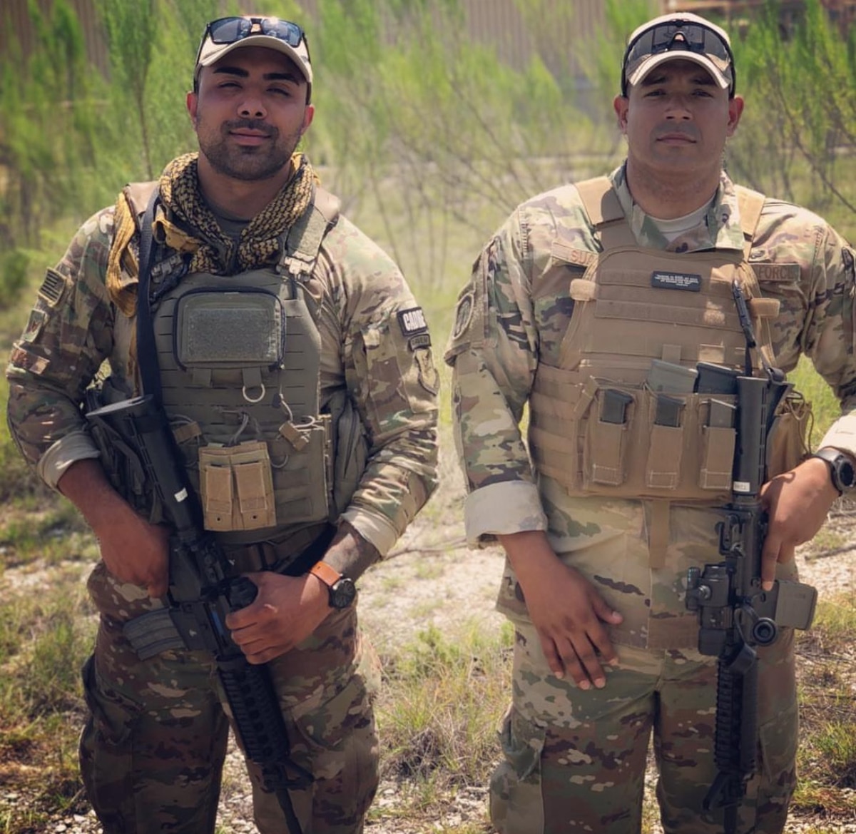 Two Airmen stand together