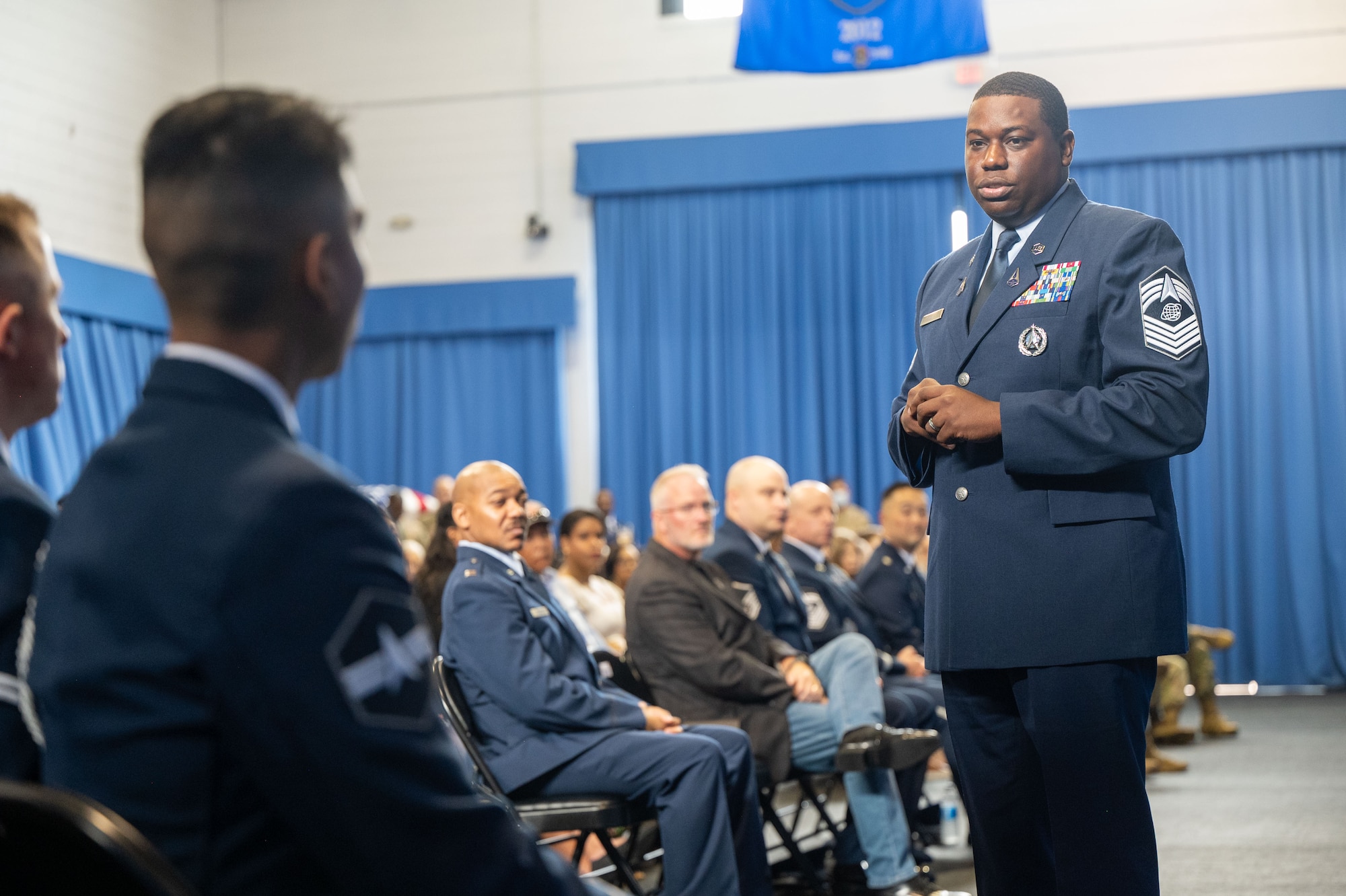 U.S. Space Force Chief Master Sgt. Abifarin Scott, enlisted force development chief for the Space Force, addresses a group of new U.S. Air Force and U.S. Space Force ceremonial guardsmen