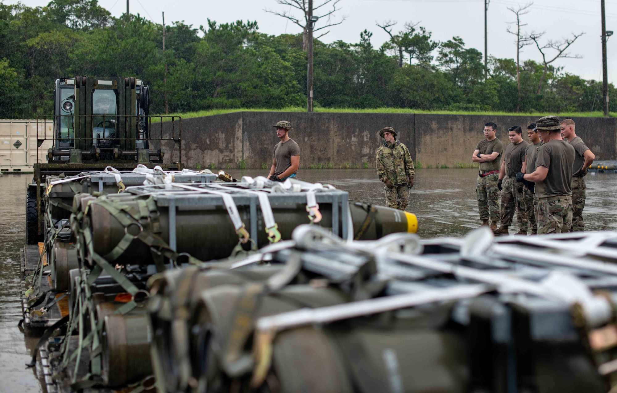 U.S. Air Force Airmen load munitions onto pallets during a tactical air-munitions rapid response package training at Kadena Air Base, Japan, Aug. 20, 2024.