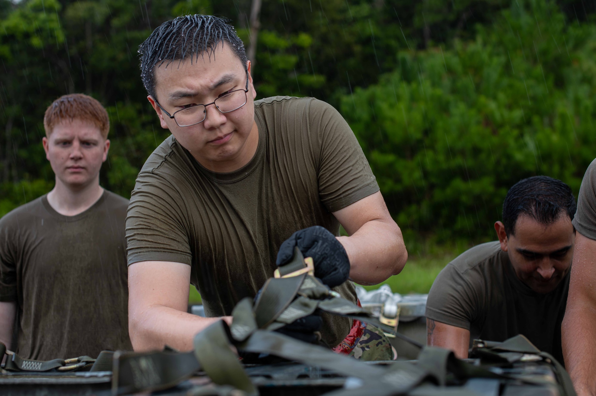 U.S. Air Force Airman 1st Class Enkhbayar Dulguun, 18th Component Maintenance Squadron avionics journeyman, loads munitions during a tactical air-munitions rapid response package training at Kadena Air Base, Japan, Aug. 20, 2024.