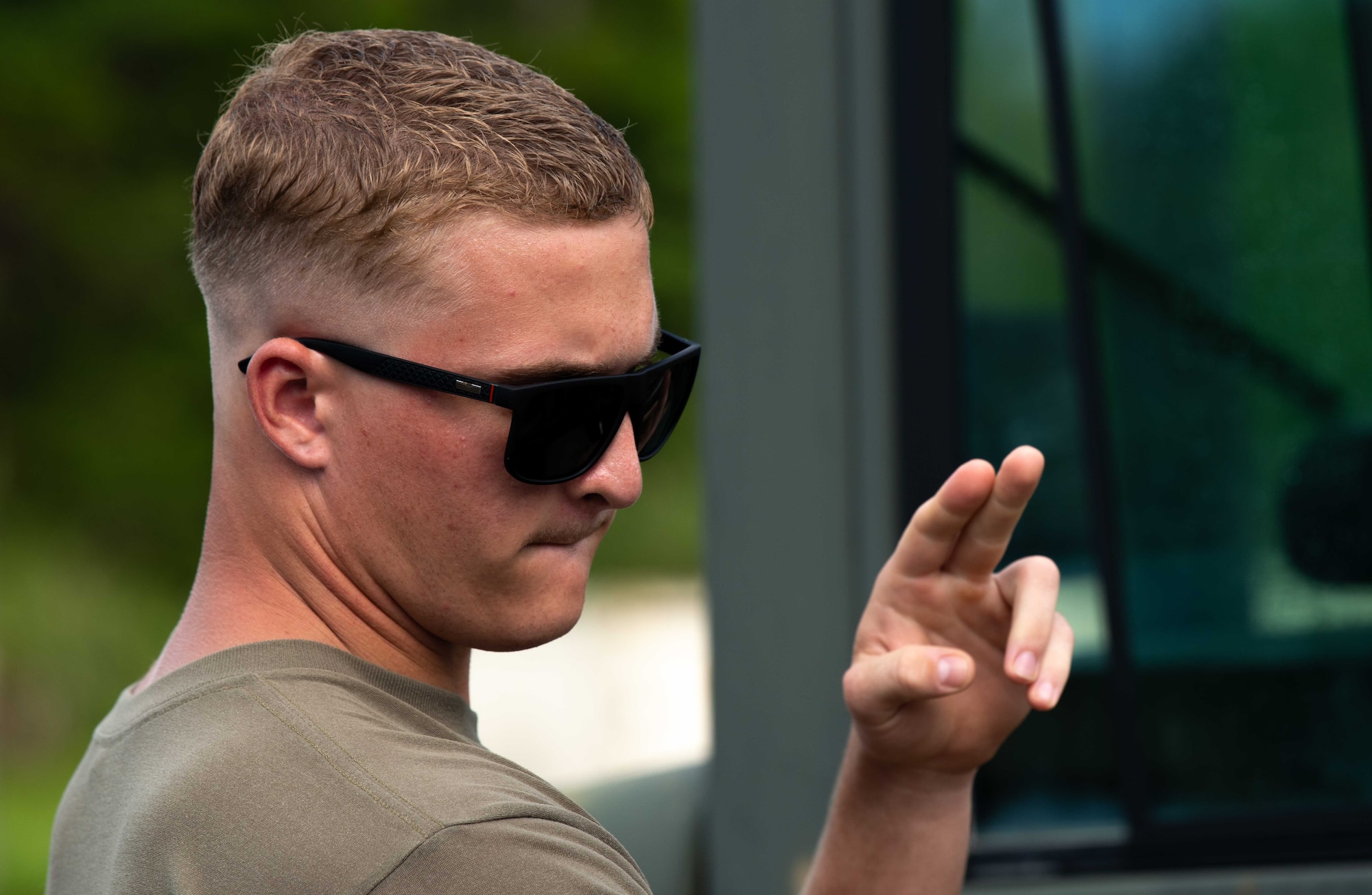 U.S. Air Force Airman Mathew Eley, 82nd Reconnaissance Squadron aerospace propulsion apprentice, marshals a forklift during a tactical air-munitions rapid response package training at Kadena Air Base, Japan, Aug. 20, 2024.