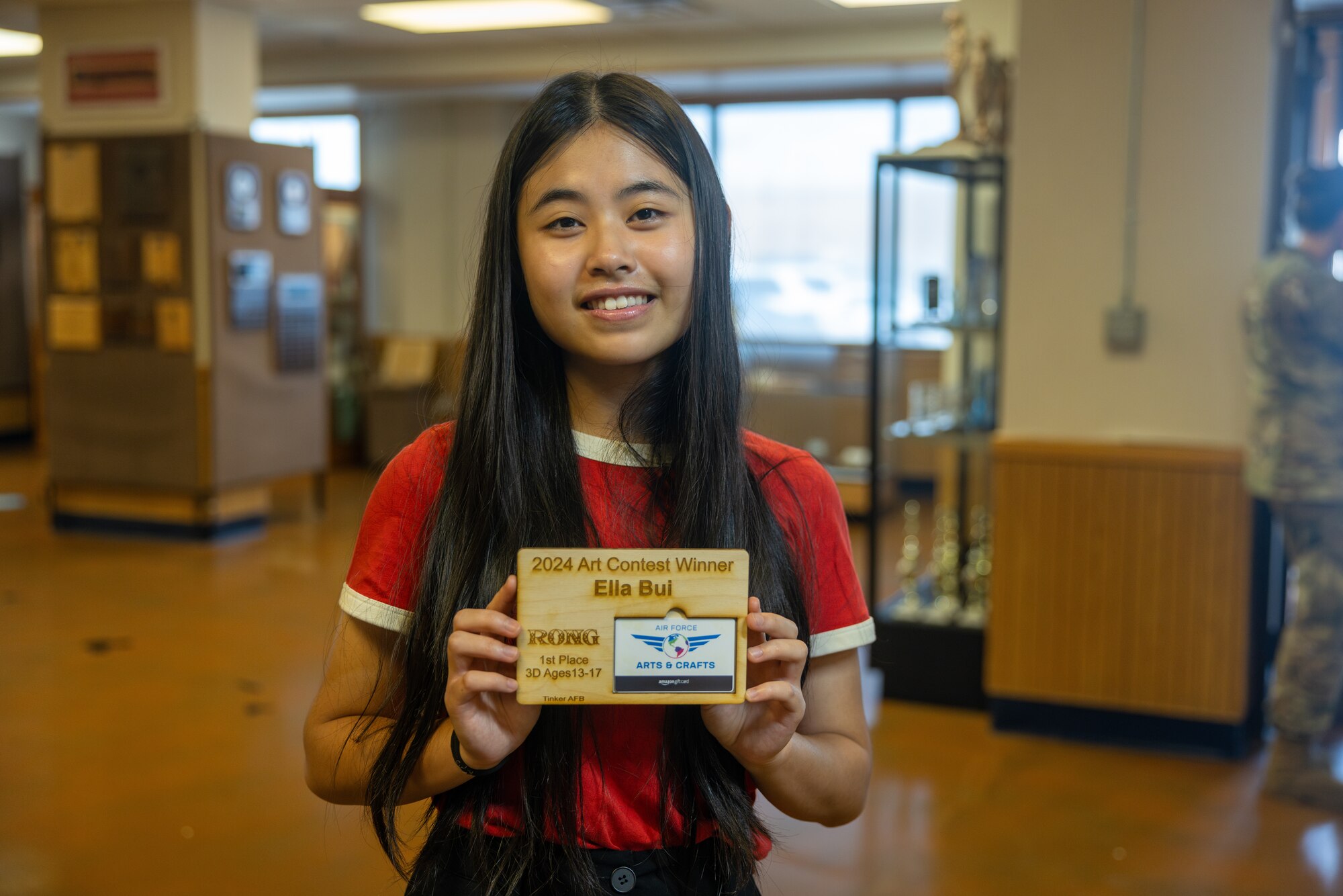 Ella Bui posing with her gift card prize.