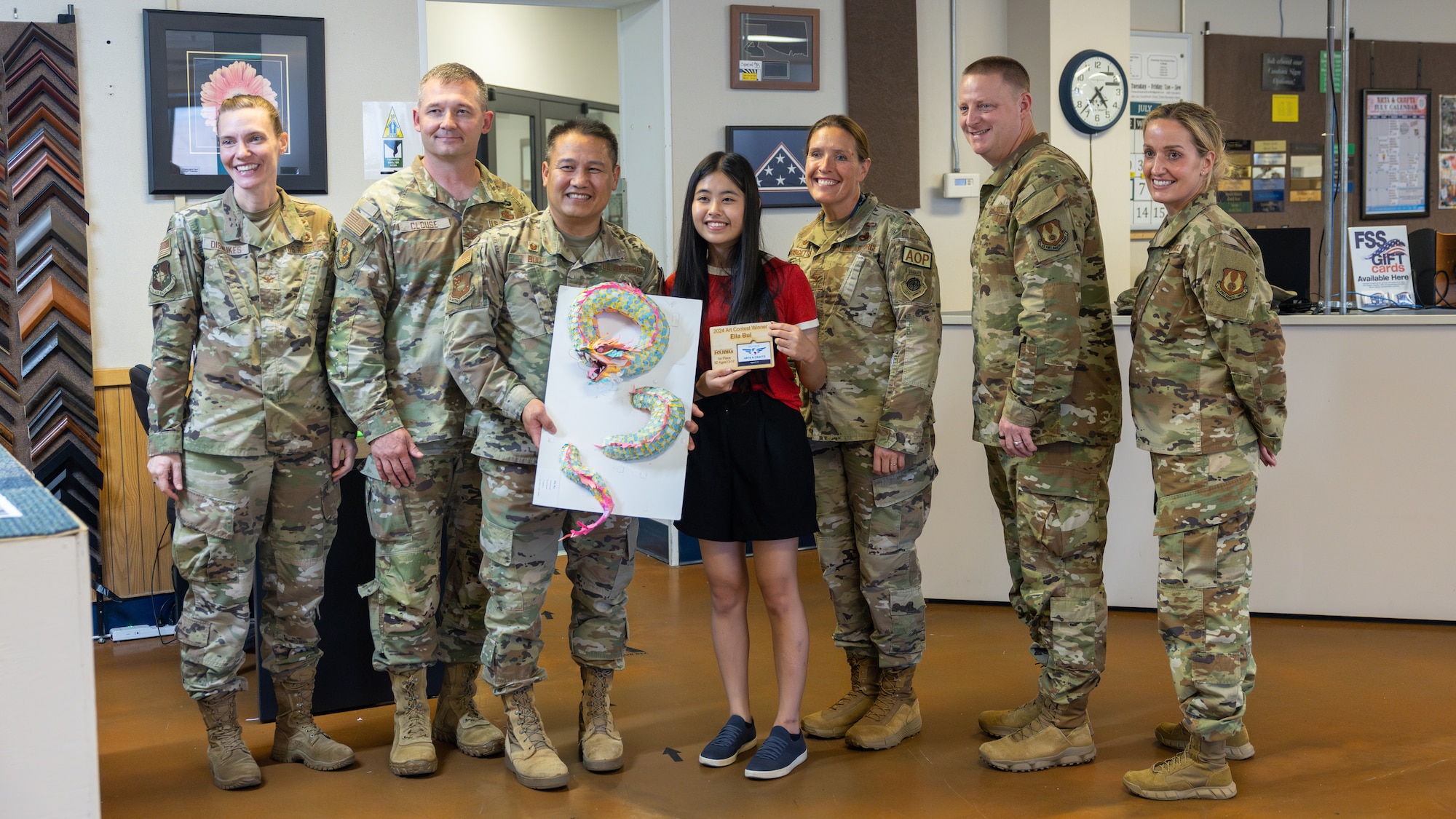 Ella Bui, contest winner, with her father and senior leaders from Tinker Air Force Base, Oklahoma
