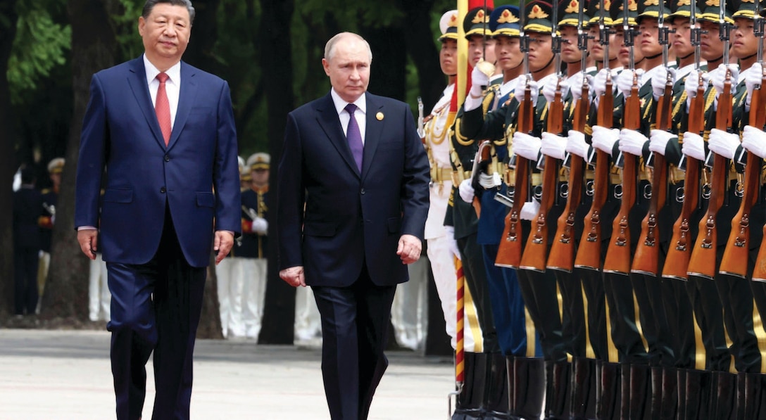 Russian President Vladimir Putin is escorted by Chinese President Xi Jinping during honor guard review at formal arrival ceremony outside
Great Hall of the People in Beijing, China.