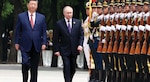 Russian President Vladimir Putin is escorted by Chinese President Xi Jinping during honor guard review at formal arrival ceremony outside
Great Hall of the People in Beijing, China.