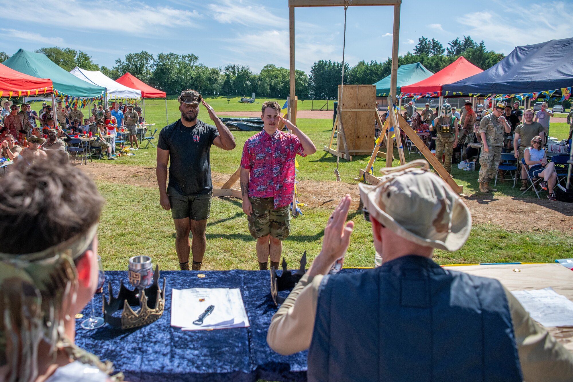 Participants salute the combat dining out council