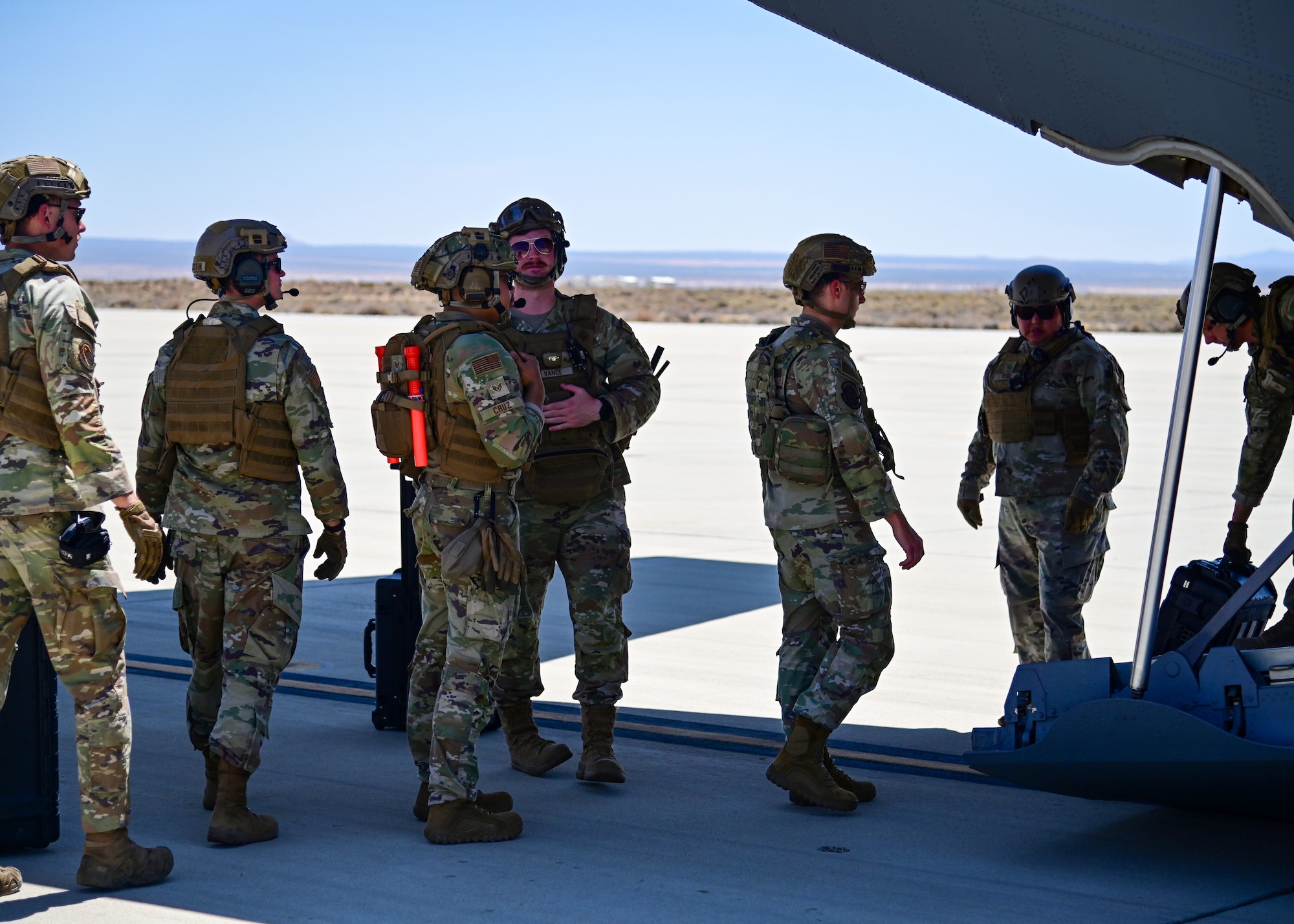 Service members board aircraft.