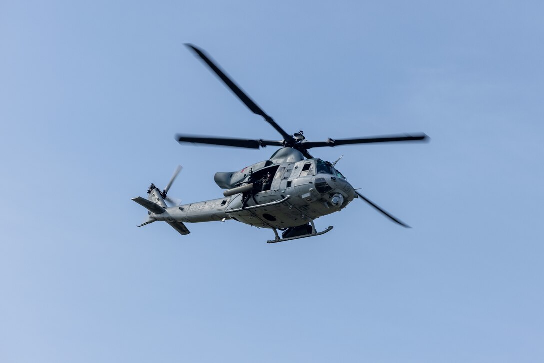 A U.S. Marine Corps UH-1Y Venom with Marine Light Attack Helicopter Squadron (HMLA) 167, 2nd Marine Aircraft Wing flies overhead during close air support as part of Unit Enhancement Training 24-2 at Marine Corps Base Camp Lejeune, North Carolina, July 18, 2024. UET-24-2 is a bilateral military exercise held to strengthen interoperability and build upon the longstanding military relationship between U.S, Marines and United Arab Emirates Presidential Guard Soldiers. (U.S. Marine Corps photo by Cpl. Rafael Brambila-Pelayo)