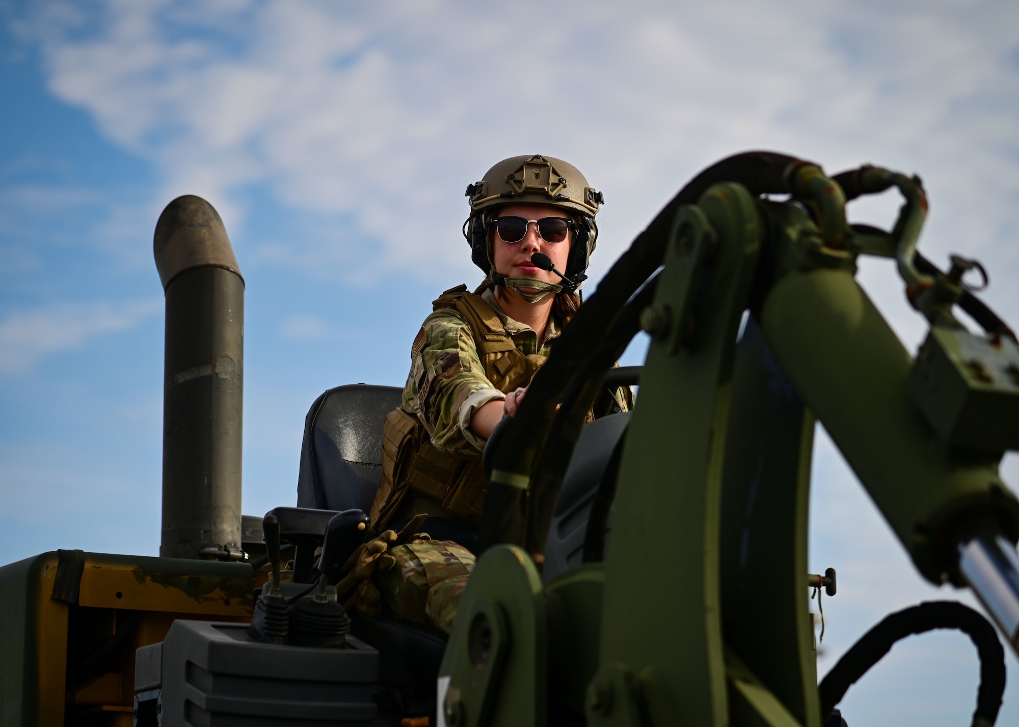 Service member operates a forklift.
