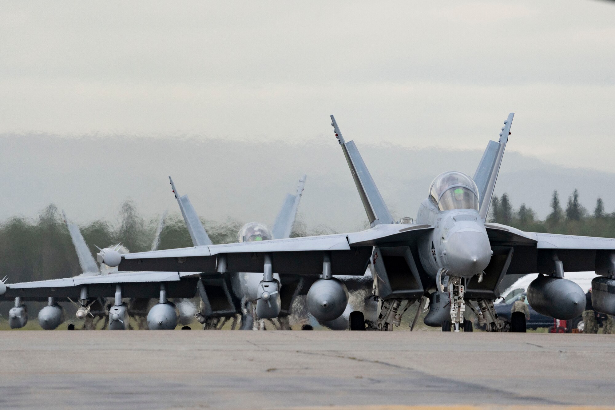 U.S. Navy EA-18G Growlers assigned to the “Ravens” of Electronic Attack Squadron (VAQ) 135, Naval Air Station Whidbey Island, Washington, prepare to take off during Red Flag-Alaska 24-3 at Eielson Air Force Base, Alaska.