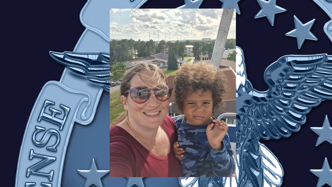 A woman and small child look at the camera.