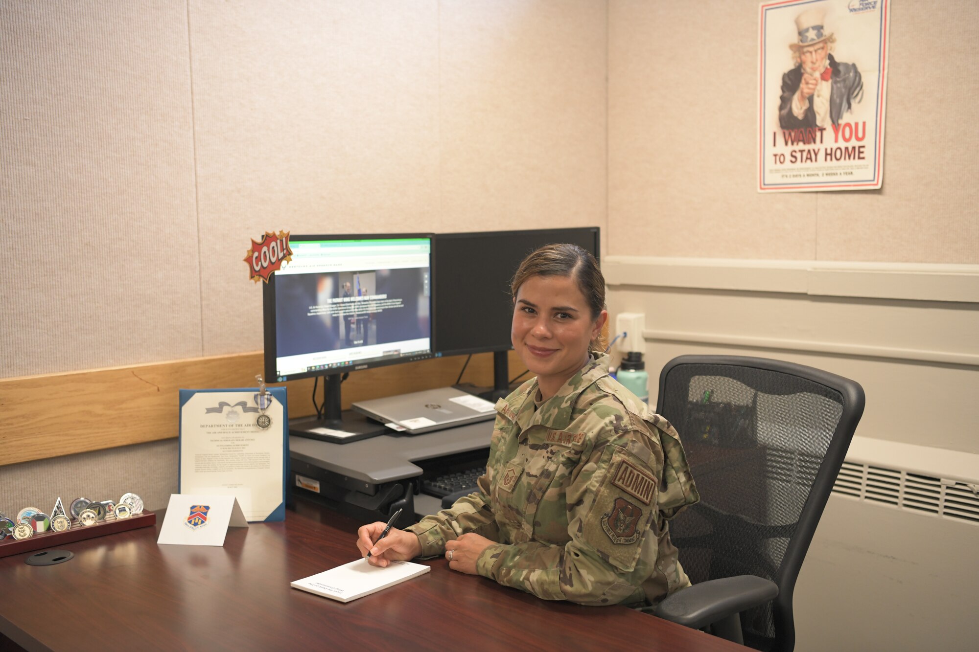 U.S. Air Force Master Sgt. Merari Antunez, 439th Airlift Wing group administration superintendent sits at her desk in Building 1850, 439 AW headquarters.  Antunez encountered and helped render aid to a woman choking at the Subway inside the Westover ARB Express gas station on Sunday, May 5, 2024.