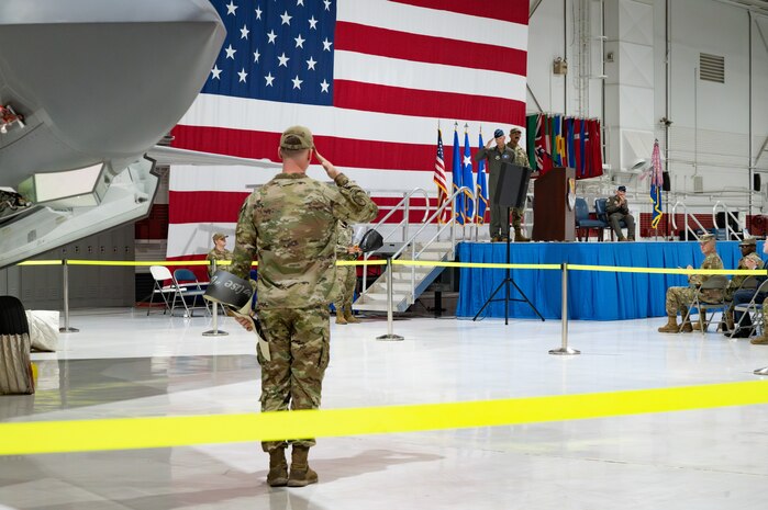 A crew chief assigned to the 57th Aircraft Maintenance Squadron, salutes Maj. Gen. Christopher Niemi, commander of the U.S. Air Force Warfare Center
