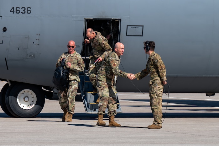 U.S. Air Force Chief of Staff Gen. David Allvin, right, Maj. Gen. Christopher Niemi, the U.S. Air Force Warfare Center (USAFWC) commander, center, and Chief Master Sergeant of the Air Force David Flosi, exit a C-130J Hercules