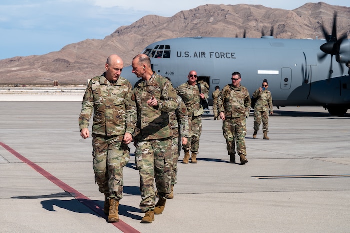 U.S. Air Force Chief of Staff Gen. David Allvin, left, and Maj. Gen. Christopher Niemi, the U.S. Air Force Warfare Center (USAFWC) commander, walk on the flightline
