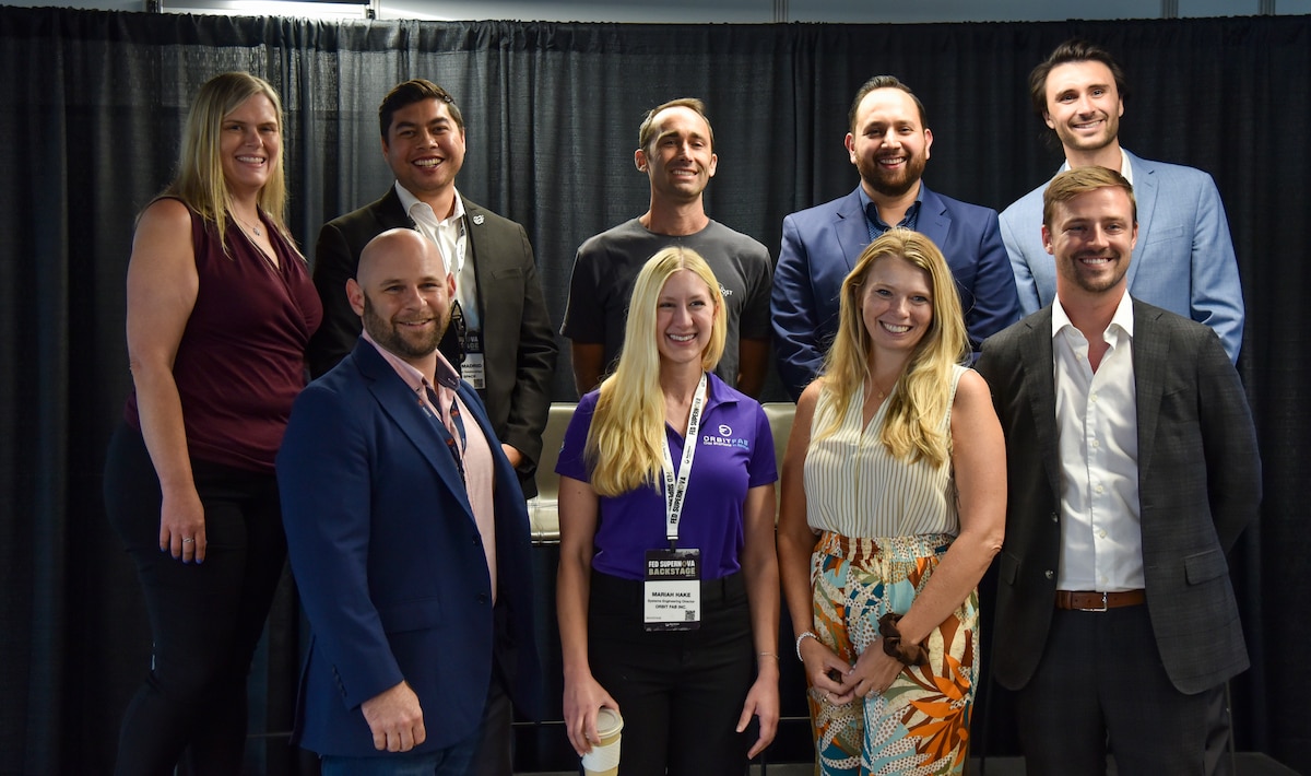 Arthur Grijalva, SpaceWERX director, and some of the SpaceWERX Program Year 2024.2 Strategic Funding Increase contract award selections from its Phase II eligible applicants pose for a photo at the Fed Supernova conference in Austin, Texas, Aug. 22, 2024.