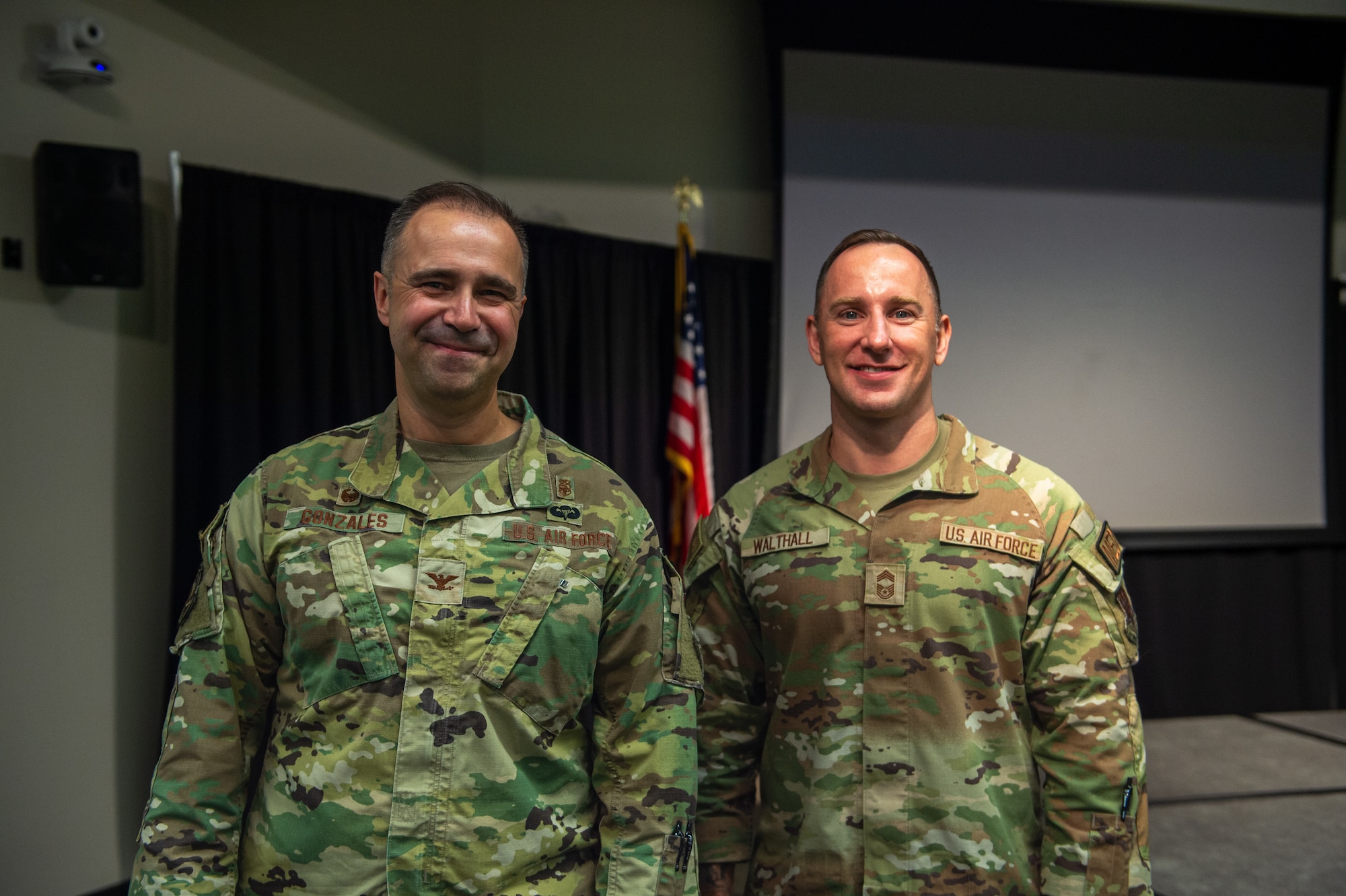 U.S. Air Force Col. Christopher Gonzales, 23rd Medical Group commander, and Chief Master Sgt. Chris Walthall, 23rd MDG senior enlisted leader, smile for a picture at Wiregrass Technical College in Valdosta, Georgia, August 21, 2024. The 23rd MDG leadership updated the community on Moody Air Force Base’s ability to stay mission ready. (U.S. Air Force photo by Airman 1st Class Iain Stanley)