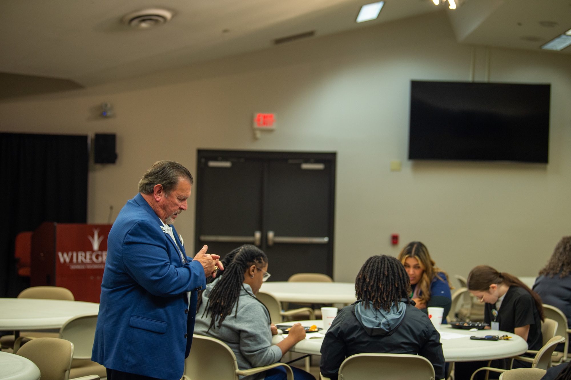 Chuck Roberts, a local community leader, leads prayer at Wiregrass Technical College in Valdosta, Georgia, August 21, 2024. Roberts coordinated this event through South Georgia Medical Group Managers Association and invited 23rd Medical Group leadership to deliver a speech. (U.S. Air Force photo by Airman 1st Class Iain Stanley)