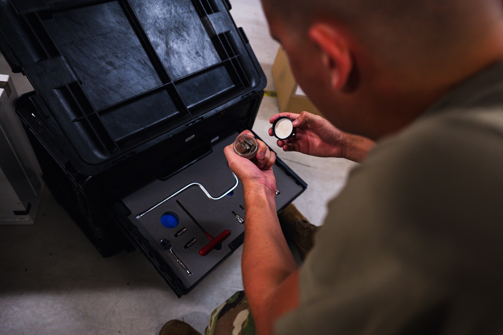 Airmen inspects tools