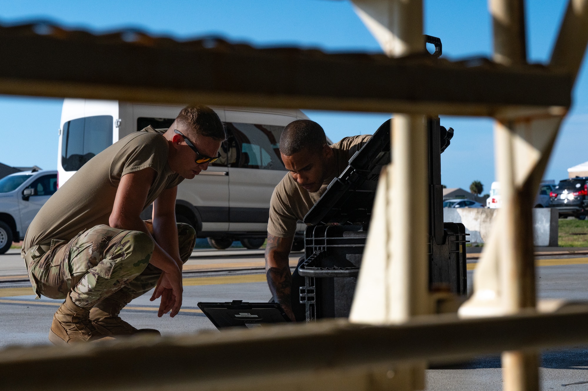 Airmen look at data on a computer
