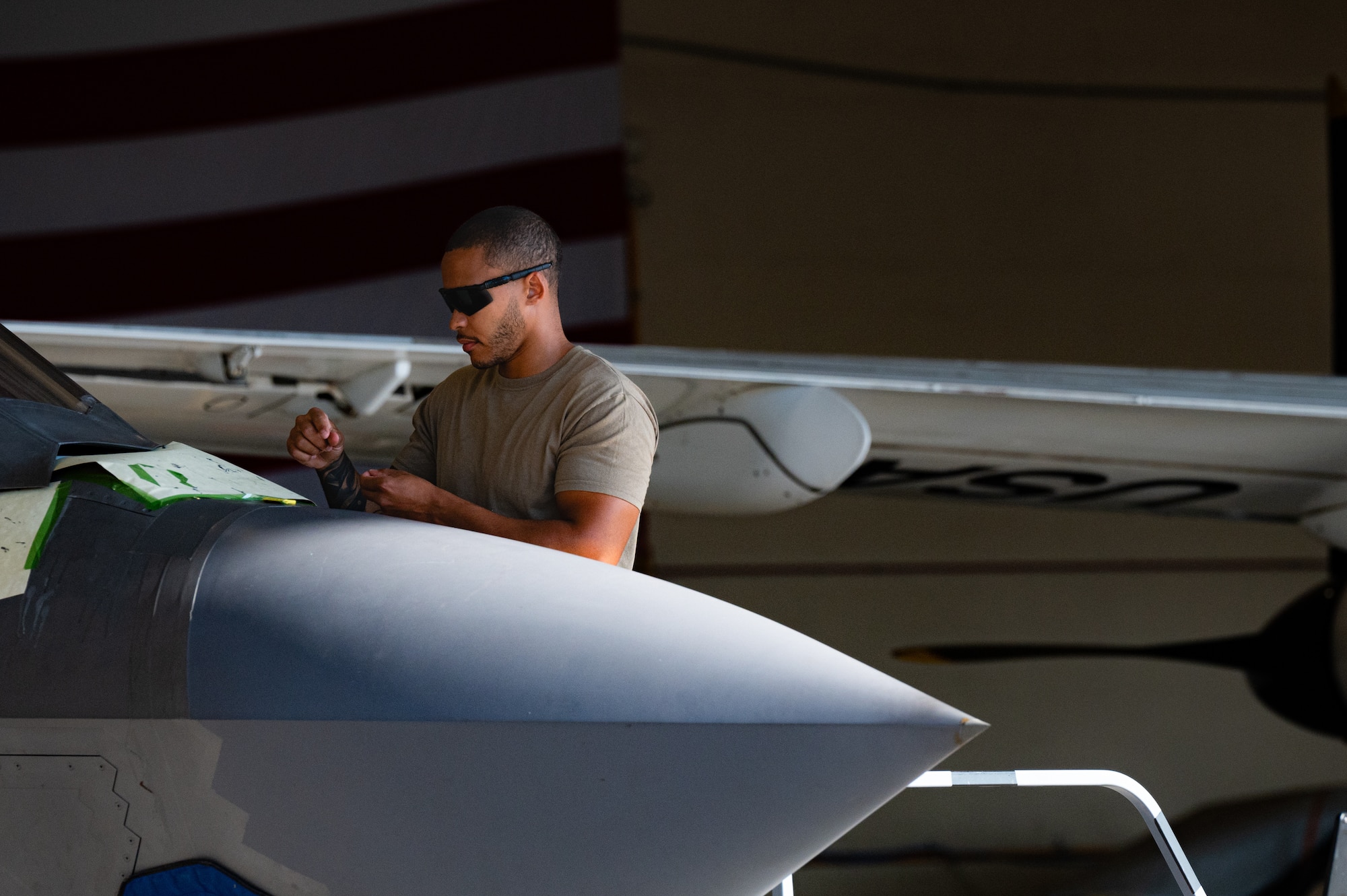Airmen measures spot on aircraft
