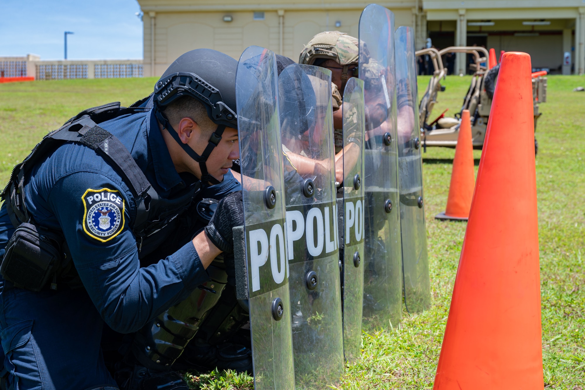 Class 24-04 Arc Light Defender Course students assigned to the 36th Security Forces Squadron pose for a photo at Andersen Air Force Base, Guam, Aug. 2, 2024. The course was designed for all 36th SFS defenders to hone their law enforcement skills through various tasks to include dismounted tactics, combat arms training, riot control and more. (U.S. Air Force photo by Senior Airman Jasmine M. Barnes)