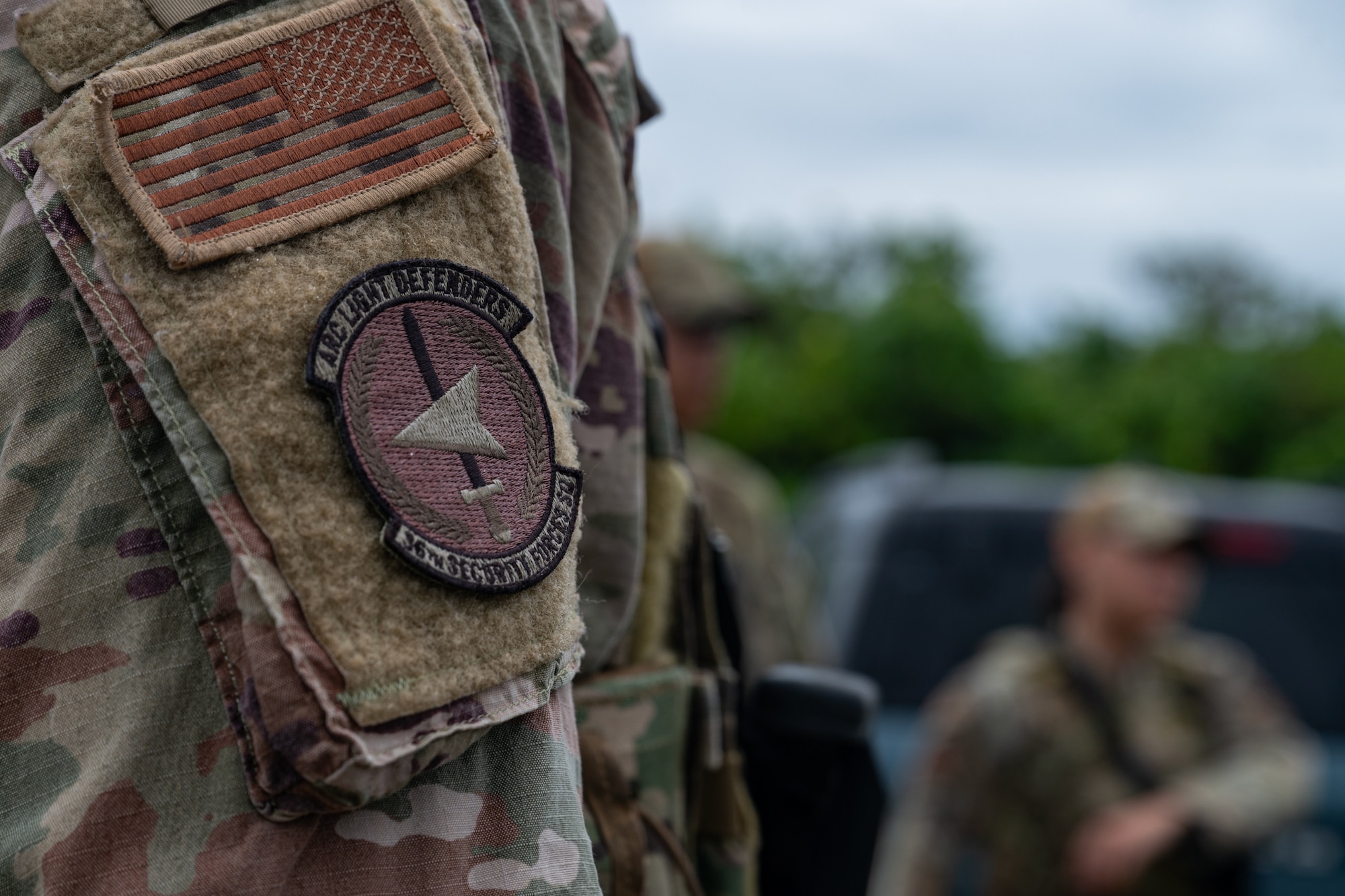 Class 24-04 Arc Light Defender Course students assigned to the 36th Security Forces Squadron pose for a photo at Andersen Air Force Base, Guam, Aug. 2, 2024. The course was designed for all 36th SFS defenders to hone their law enforcement skills through various tasks to include dismounted tactics, combat arms training, riot control and more. (U.S. Air Force photo by Senior Airman Jasmine M. Barnes)