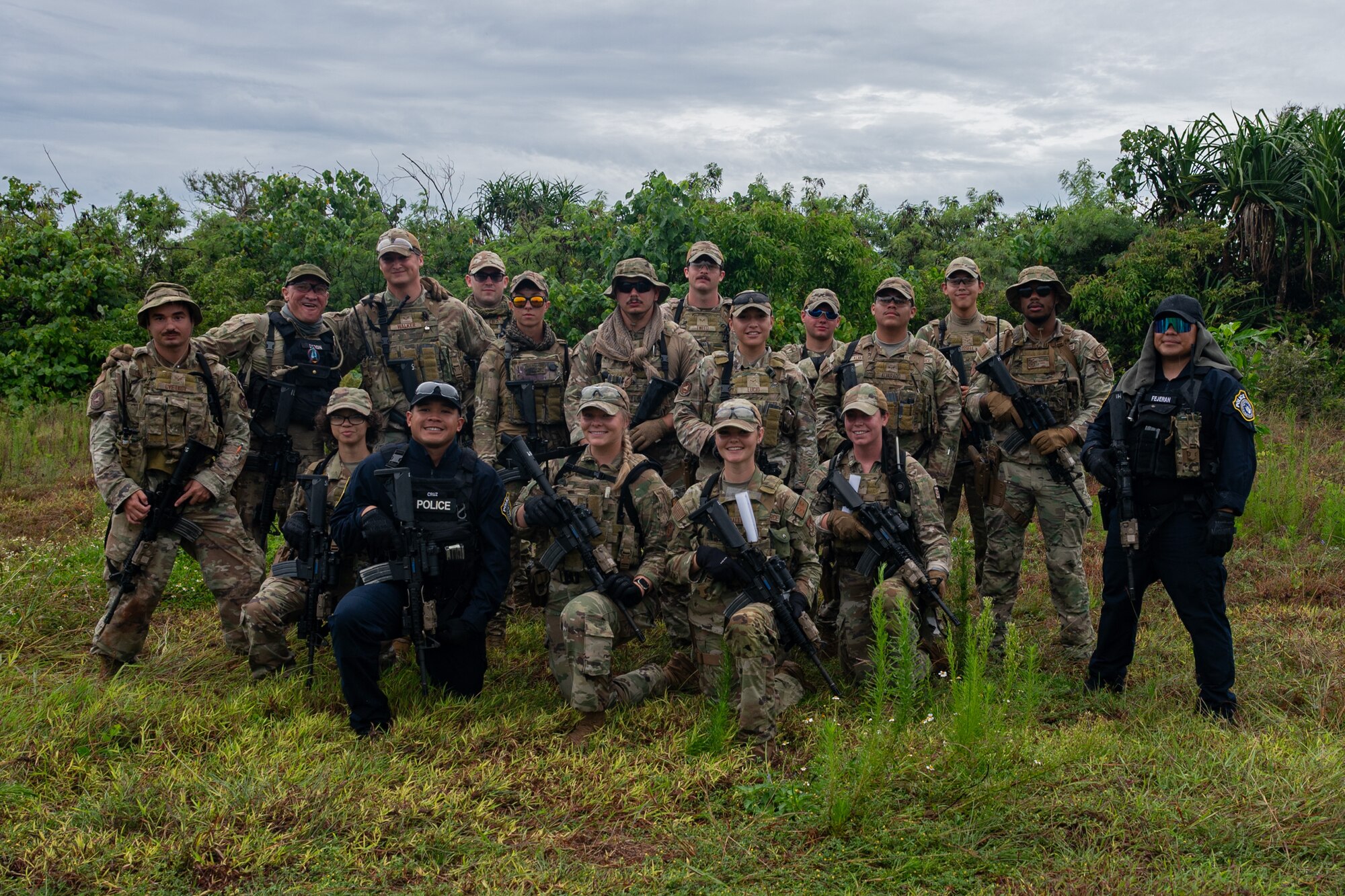 Class 24-04 Arc Light Defender Course students assigned to the 36th Security Forces Squadron pose for a photo at Andersen Air Force Base, Guam, Aug. 2, 2024. The course was designed for all 36th SFS defenders to hone their law enforcement skills through various tasks to include dismounted tactics, combat arms training, riot control and more. (U.S. Air Force photo by Senior Airman Jasmine M. Barnes)