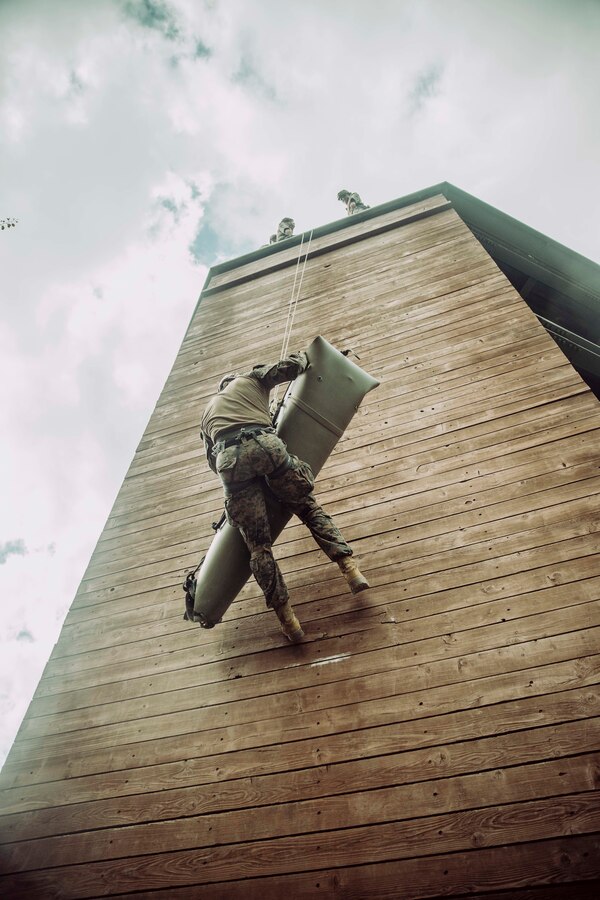 U.S. Marines and Sailors assigned to Reconnaissance Company, 15th Marine Expeditionary Unit, hoist a simulated casualty up a rappel tower during mountain rescue training led by Republic of Korea Marines at ROK Marine Corps Base Pohang, South Korea, Aug. 16, 2024. Integrated training between the two countries strengthens the ROK-U.S. Alliance through bilateral, joint training, contributing toward combined capability in defense of the Korean Peninsula. (U.S. Marine Corps photo by Cpl. Joseph Helms)
