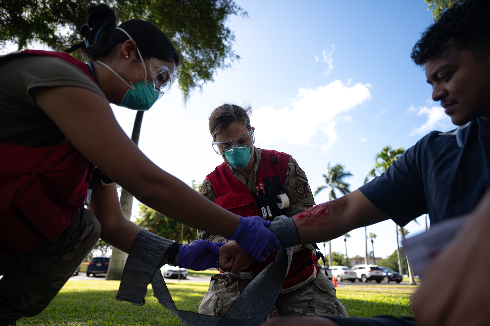 Airmen treat simulated patients during an exercise.