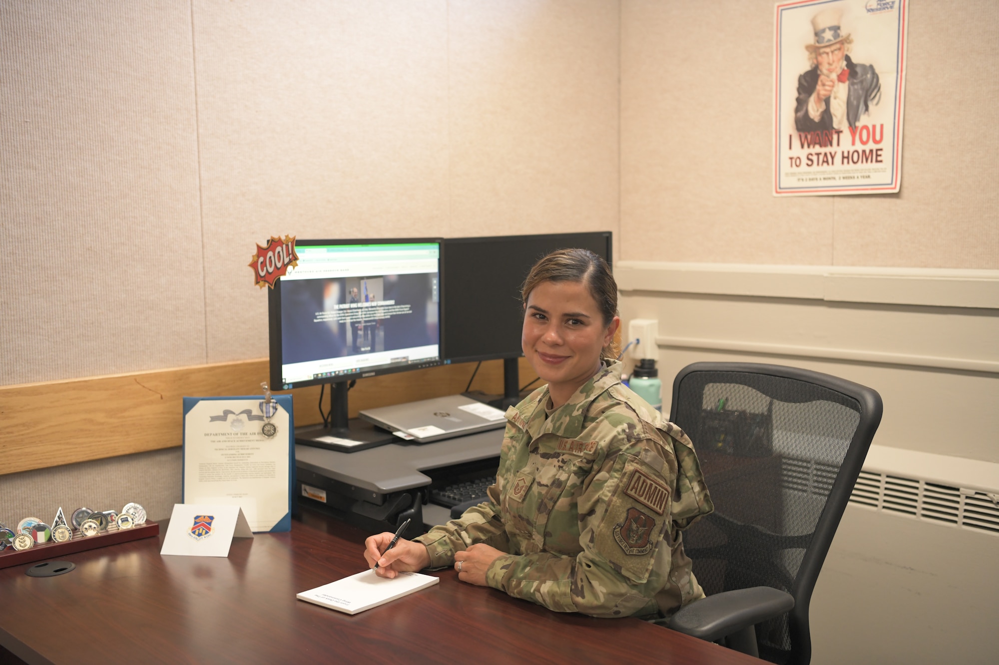 U.S. Air Force Master Sgt. Merari Antunez, 439th Airlift Wing group administration superintendent sits at her desk in Building 1850, 439 AW headquarters.  Antunez encountered and helped render aid to a woman choking at the Subway inside the Westover ARB Express gas station on Sunday, May 5, 2024.