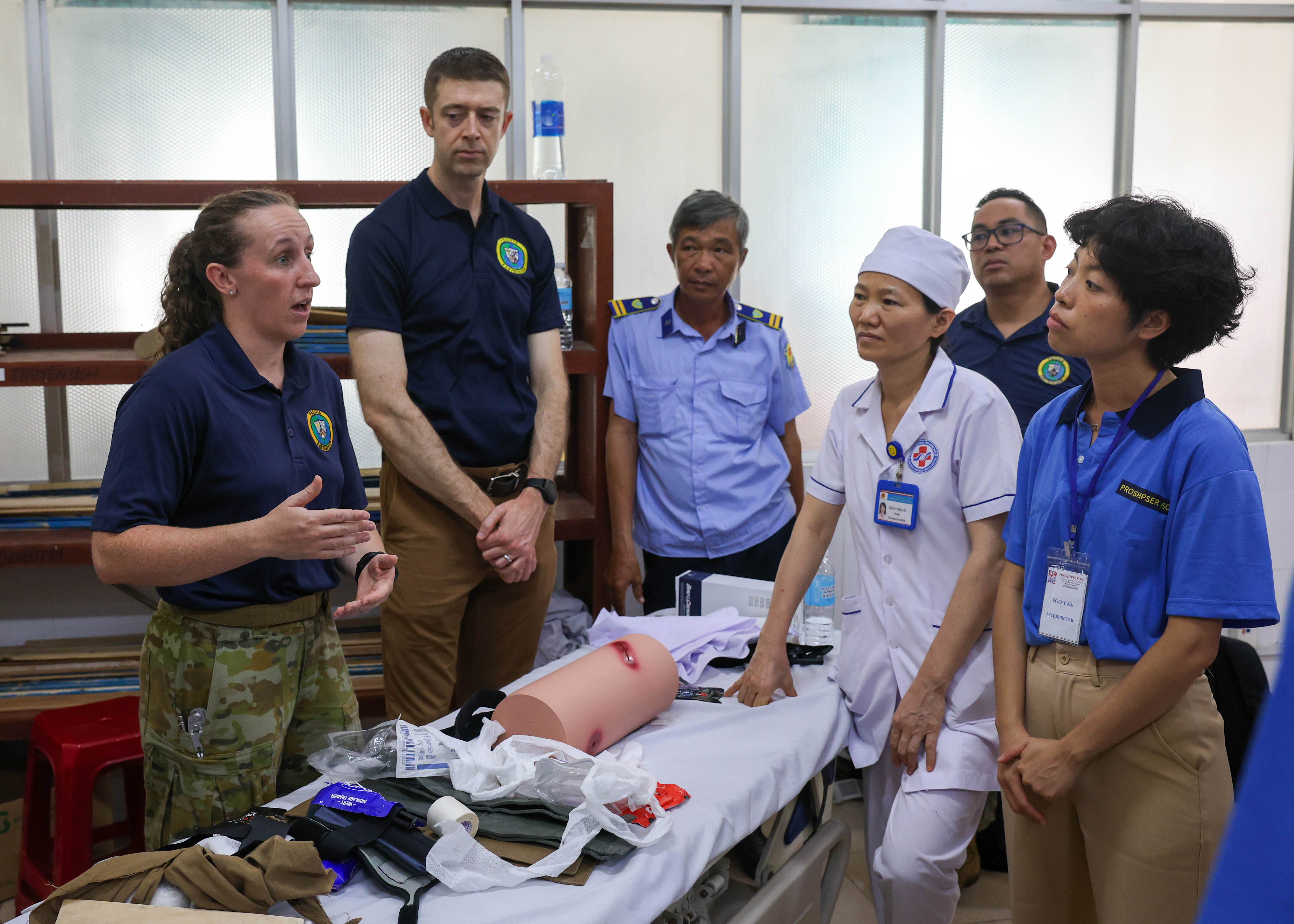 QUANG NGAI, Vietnam (Aug 22. 2024) - Australian Army Capt. Victoria Flegg, a nursing officer with Pacific Partnership 2024-2 (PP24-2), talks about conserving heat while operating on the abdomen with local medical staff at the General Hospital in Quang Ngai, Vietnam, Aug. 22, 2024. Now in its 20th iteration, the Pacific Partnership series is the largest annual multinational humanitarian assistance and disaster relief preparedness mission conducted in the Indo-Pacific. Pacific Partnership works collaboratively with host and partner nations to enhance regional interoperability and disaster response capabilities, increase security and stability in the region, and foster new and enduring friendships in the Indo-Pacific. (U.S. Navy photo by Mass Communication Specialist Seaman Gavin Arnoldhendershot)