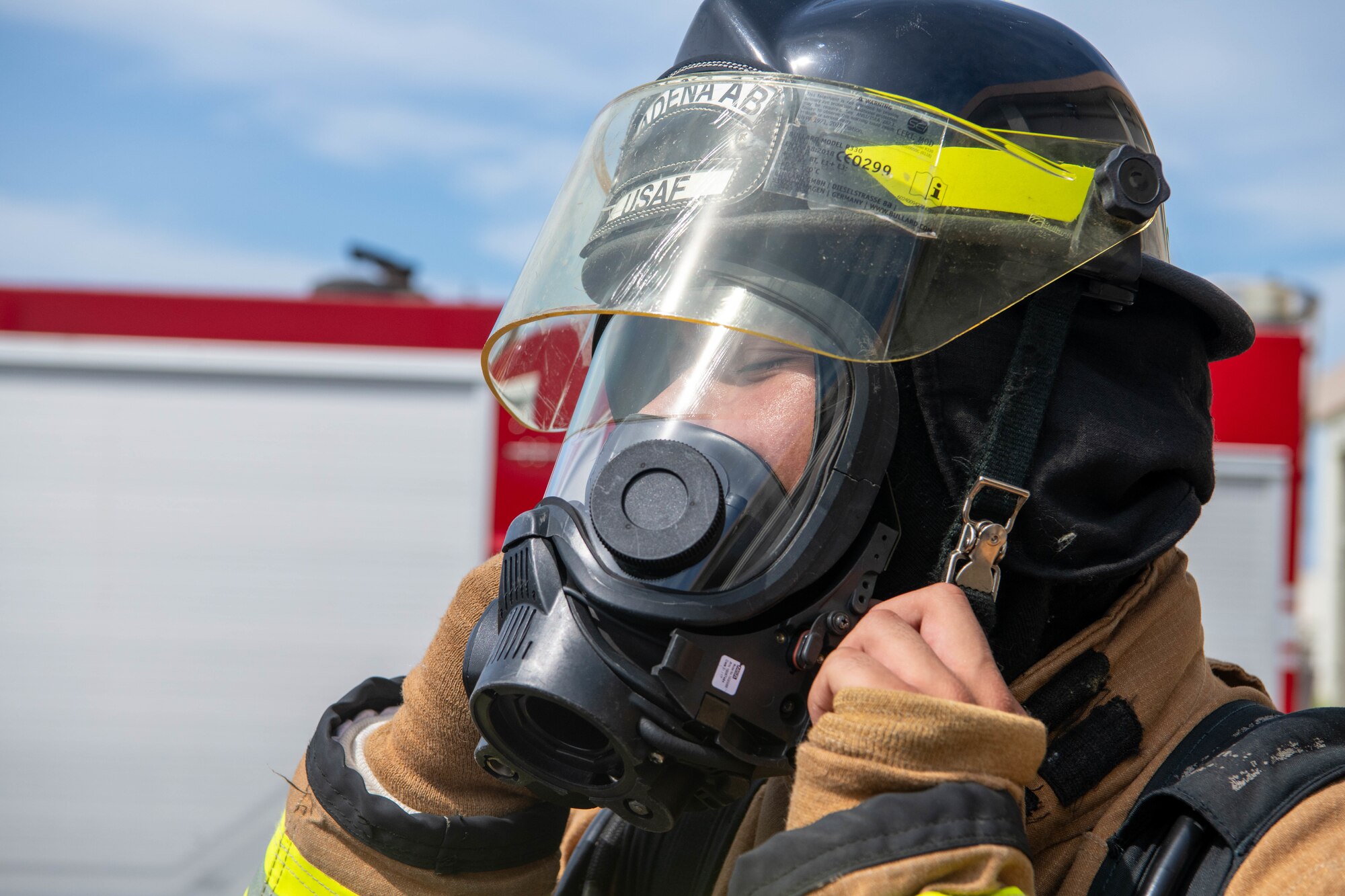 firemen puts on resporator