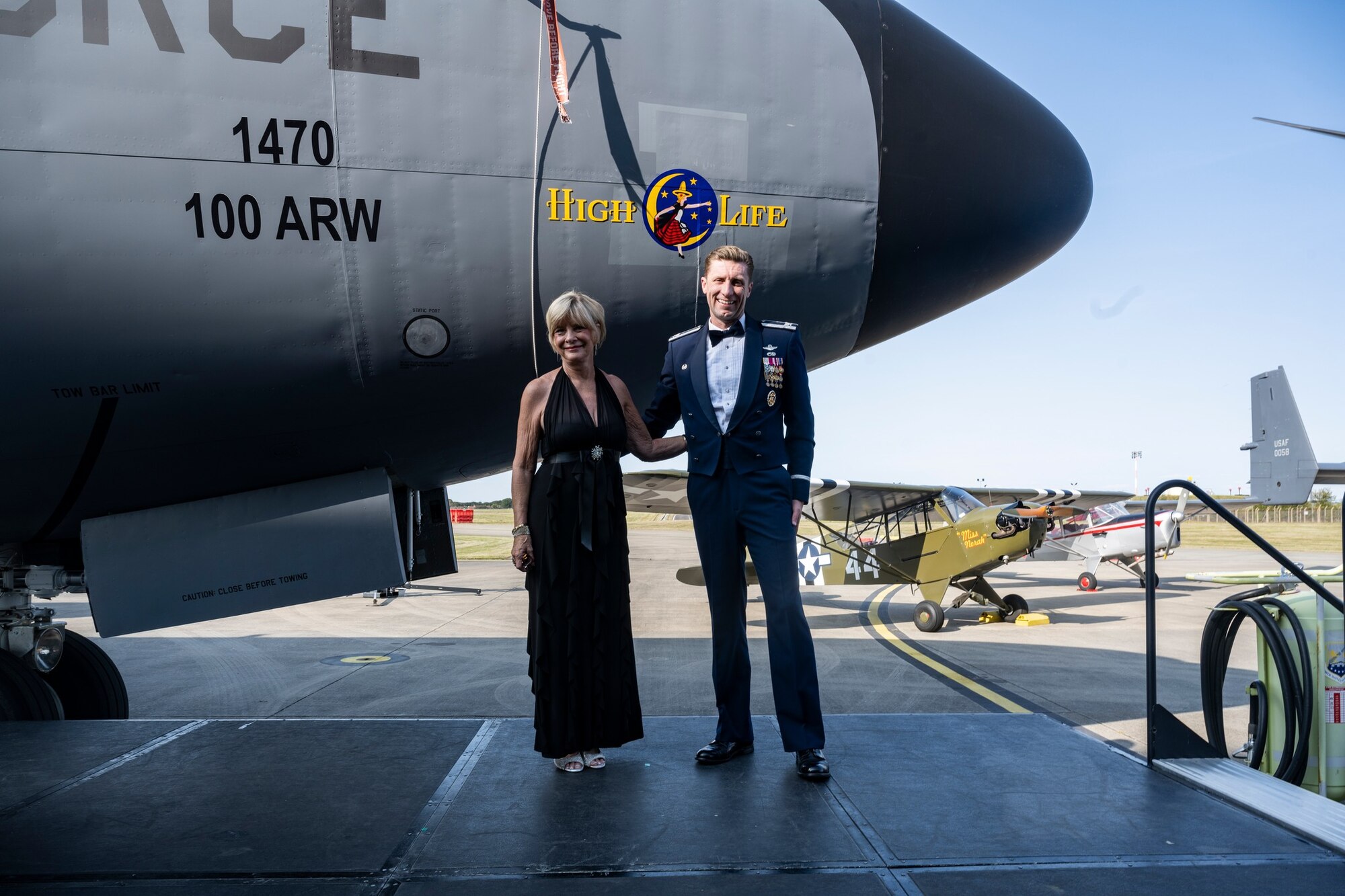 Paula Harper-Sparks, left, and U.S. Air Force Col. Ryan Garlow, 100th Air Refueling Wing commander, pose for a photo during the nose art unveiling of “High Life” at Royal Air Force Mildenhall, England, Aug. 17, 2024. Harper-Sparks and Garlow both spoke at the nose art dedication ceremony to commemorate their family members – her father and his step-grand-father – who both served in the Bloody Hundredth and were part of the High Life crew during World War II. (U.S. Air Force photo by Senior Airman Alvaro Villagomez)