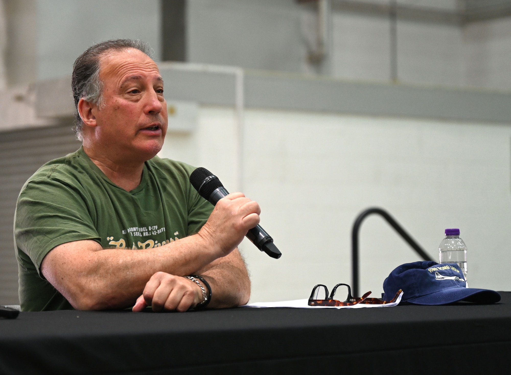 Dan Rosenthal, 100th Bomb Group Foundation board of directors member, shares stories of his father, U.S. Army Air Forces Lt. Col. Robert “Rosie” Rosenthal, renowned100th Bomb Group pilot who flew 53 missions out of Thorpe Abbotts, England, during World War II, to the audience during Heritage Day at Royal Air Force Mildenhall, England, Aug. 16, 2024. Rosie was one of the main characters featured in the Apple+ mini-series, “Masters of the Air,” which focused on Eighth Air Force and the 100th Bomb Group during World War II, and was highlighted as part of RAF Mildenhall’s Heritage Day celebration. (U.S. Air Force photo by Karen Abeyasekere)