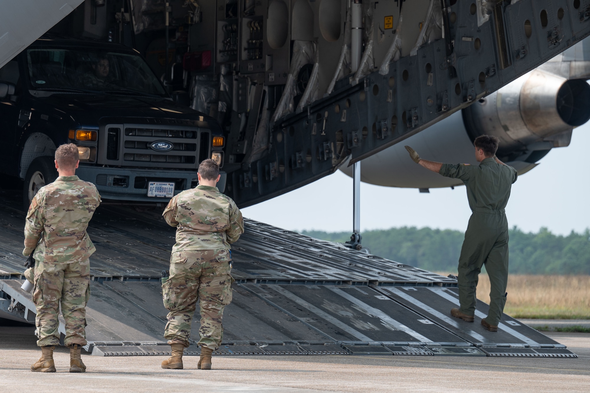 Loadmaster directs a forklift.