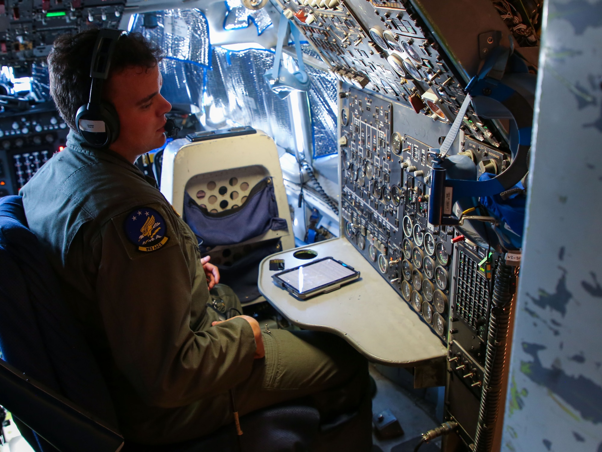 Senior Airman Owen Grissom, a flight engineer from the 552nd Airborne Air Control Squadron, conducts preflight checks onboard an E-3 Sentry during Bamboo Eagle 24-3 at Nellis Air Force Base, Nev., Aug. 8, 2024. The 552nd ACS plays a critical role in ensuring the E-3 is mission-ready for this large-scale exercise, which tests the integration of multiple air and ground assets. (U.S. Air Force photo by Garrett N. Cole)
