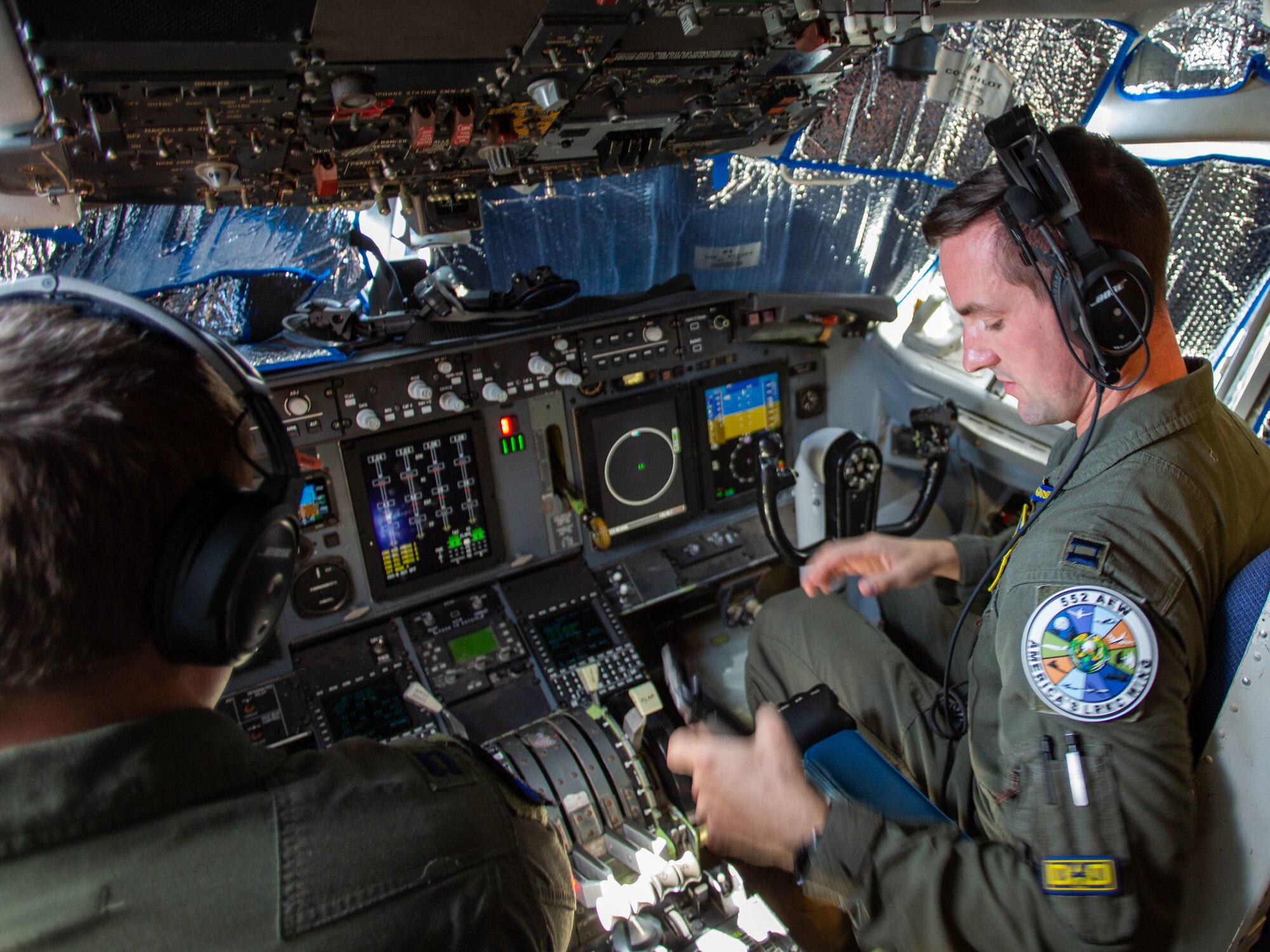 Capt. Zachary Siefken, an E-3 pilot and Deputy Chief of Weapons and Tactics in the 965th Airborne Air Control Squadron, conducts preflight checks onboard an E-3 Sentry during Bamboo Eagle 24-3 at Nellis Air Force Base, Nev., Aug. 8, 2024. As a key leader in the 965th AACS, Capt. Siefken plays a crucial role in ensuring mission success by overseeing the readiness of the E-3 for this vital exercise. (U.S. Air Force photo by Garrett N. Cole)