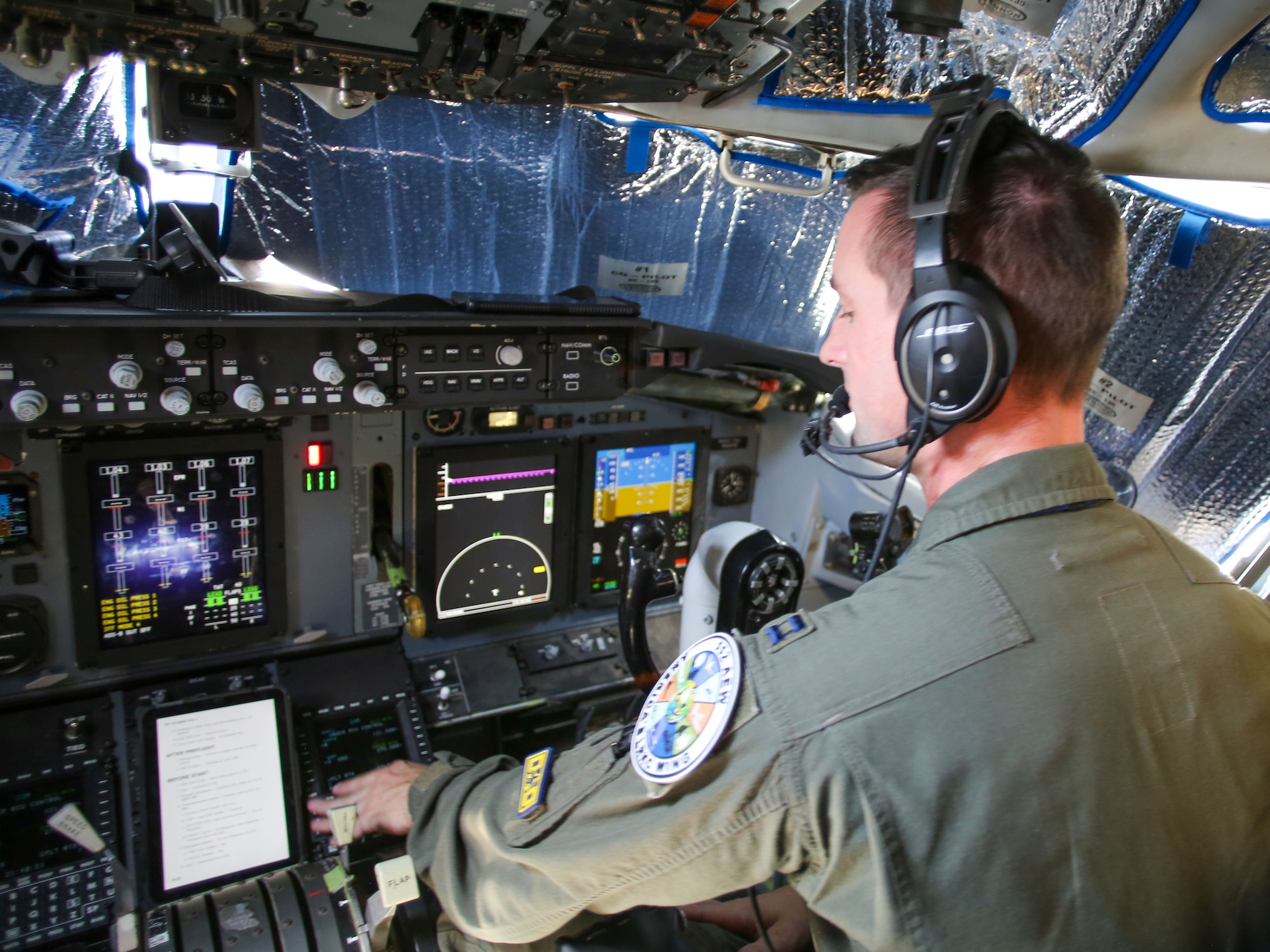 Capt. Zachary Siefken, an E-3 pilot and Deputy Chief of Weapons and Tactics in the 965th Airborne Air Control Squadron, conducts preflight checks onboard an E-3 Sentry during Bamboo Eagle 24-3 at Nellis Air Force Base, Nev., Aug. 8, 2024. As a key leader in the 965th AACS, Capt. Siefken plays a crucial role in ensuring mission success by overseeing the readiness of the E-3 for this vital exercise. (U.S. Air Force photo by Garrett N. Cole)